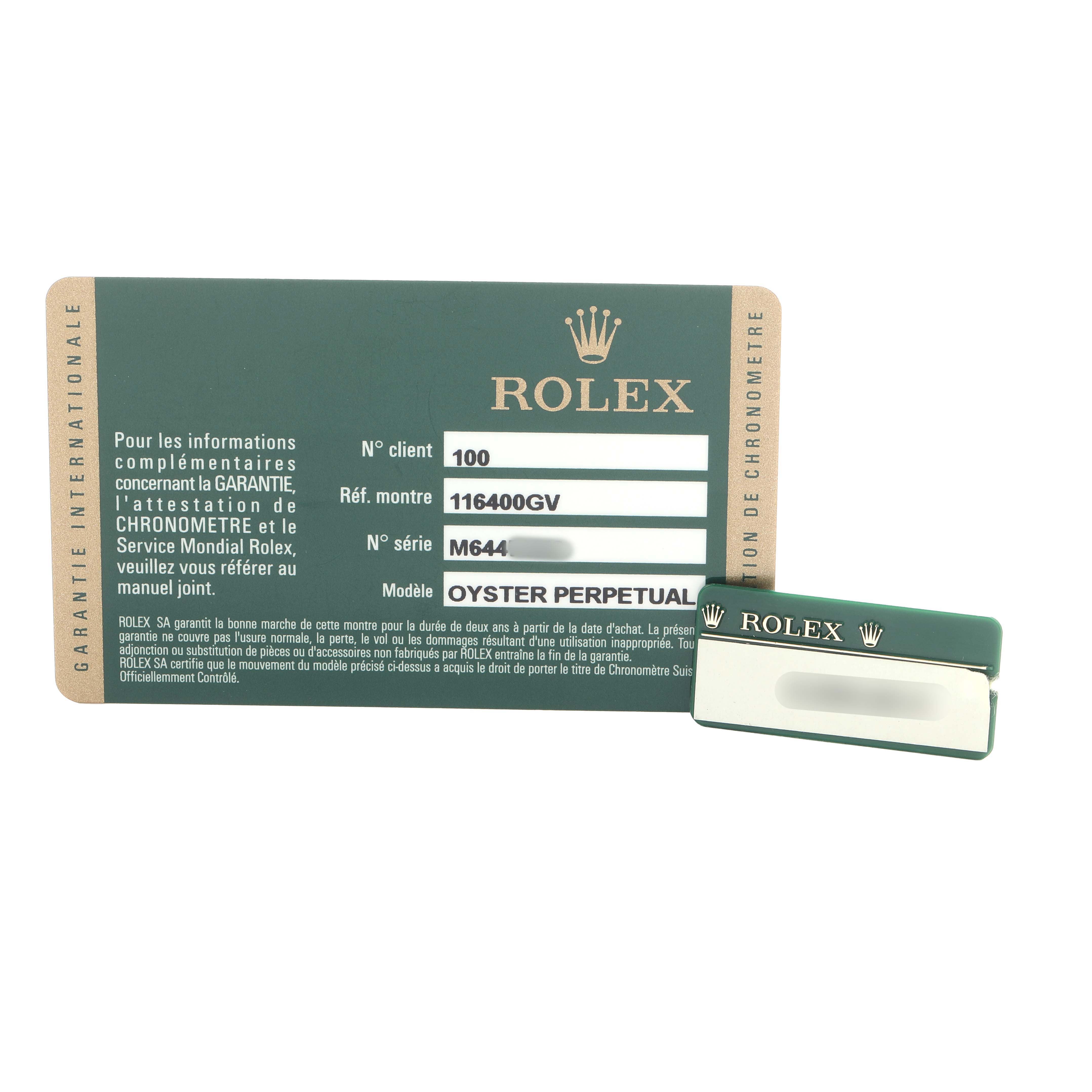 The image shows a Rolex warranty card and cardholder for the Milgauss model, displaying model and serial information.