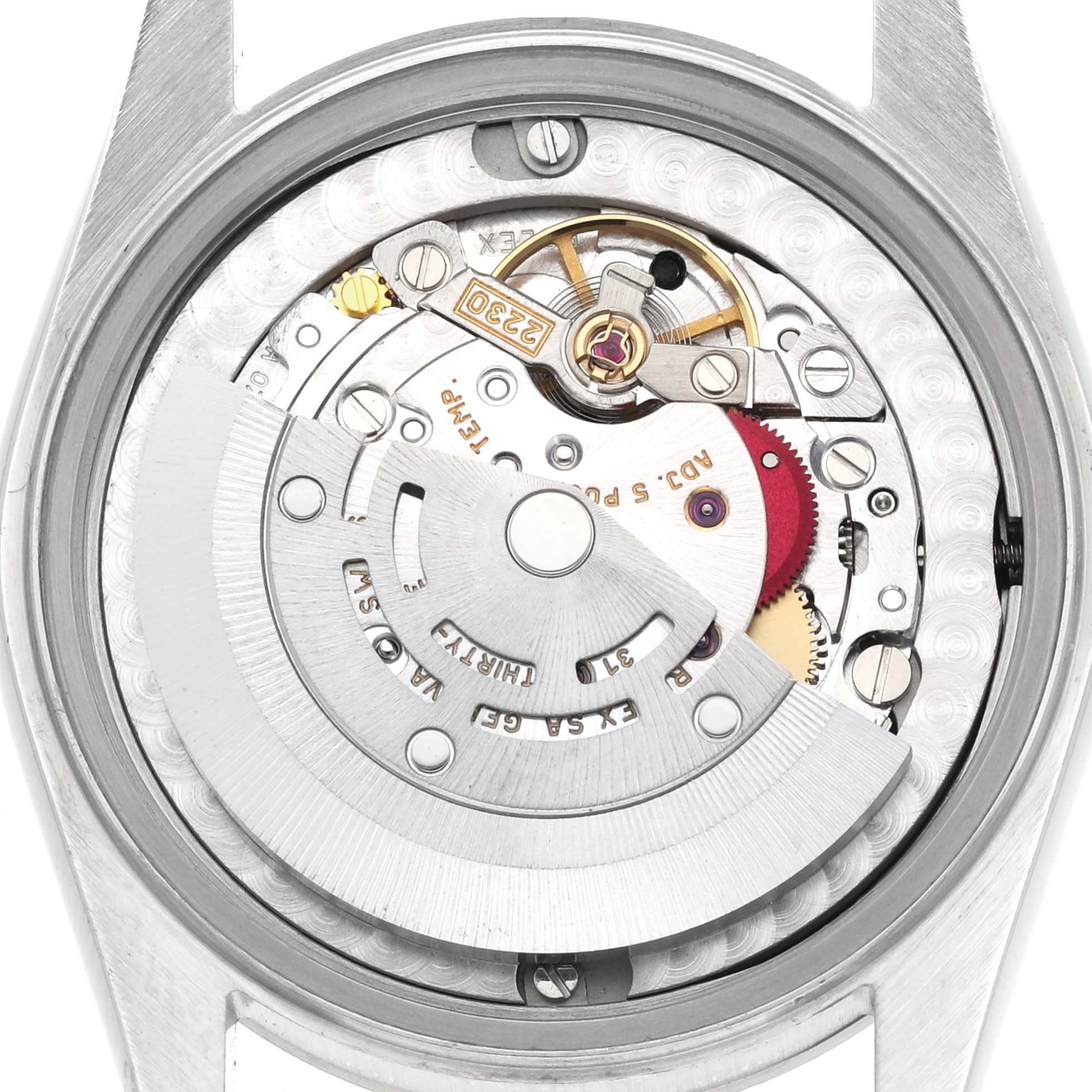 The image shows the internal mechanism of a mid-size Rolex watch from a top-down angle.