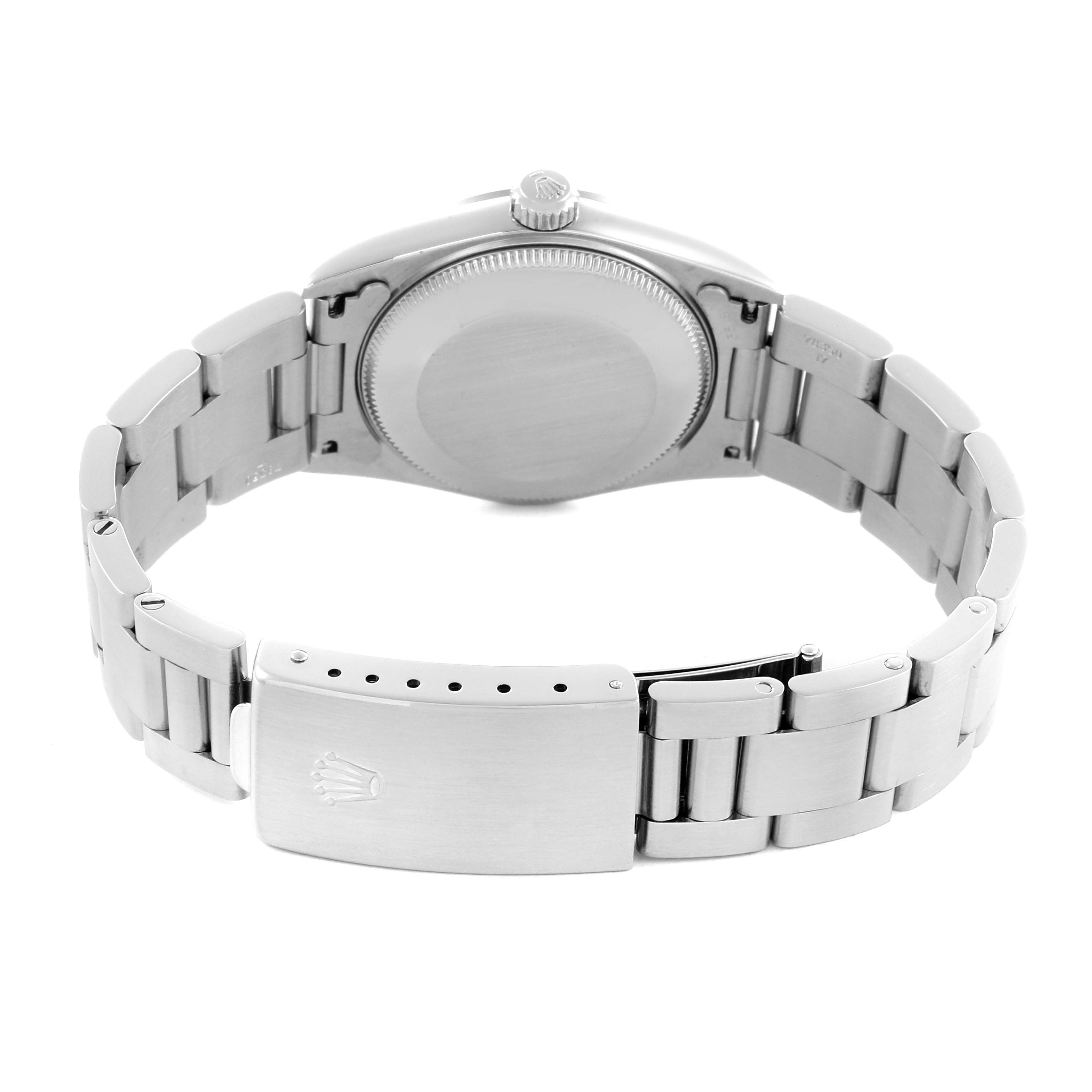 The image shows the back case and clasp of a Rolex Mid-Size 77080 Women's Stainless Steel Black Dial 77080 Women's Stainless Steel Black Dial watch, focusing on the bracelet and case back.