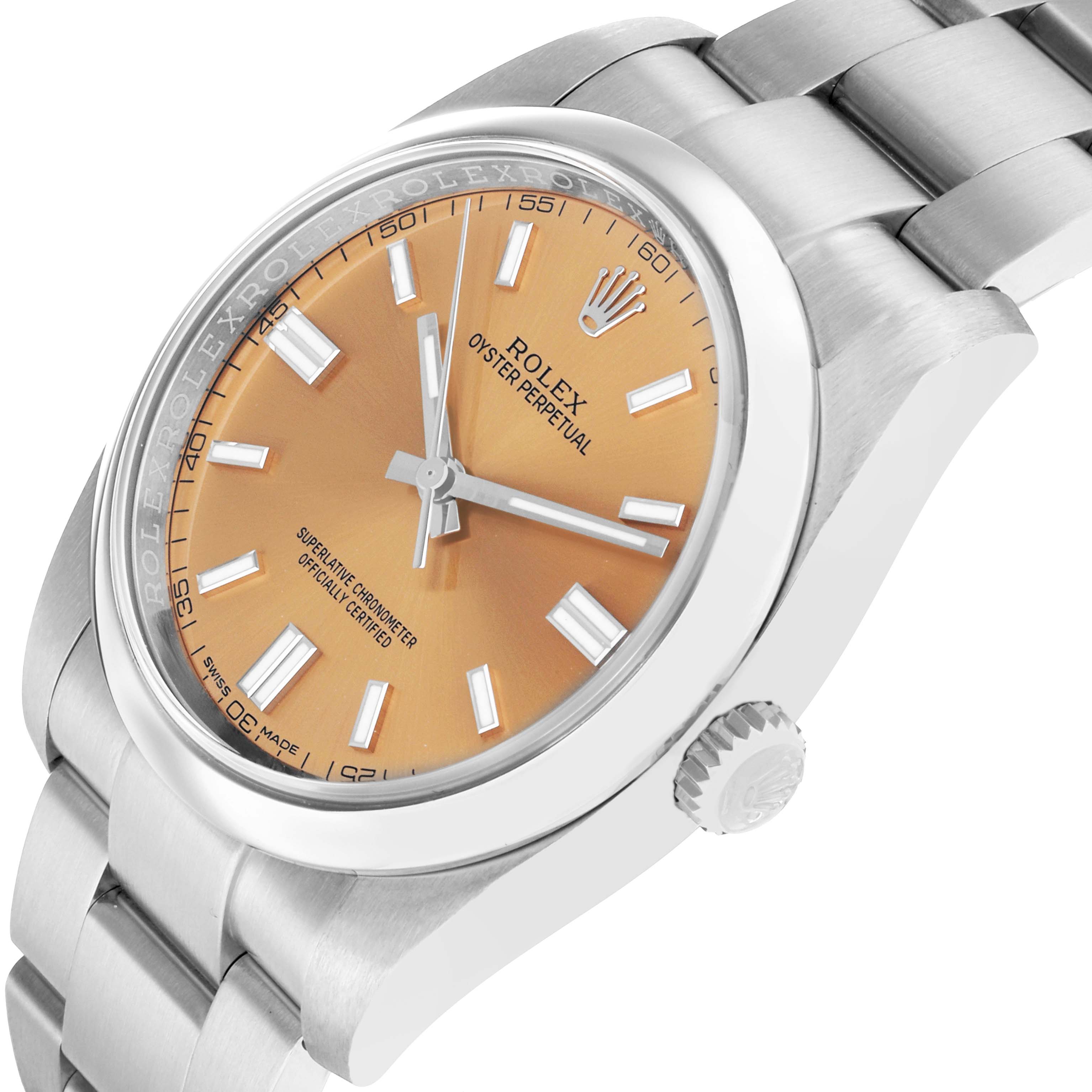 The Rolex Oyster Perpetual 116000 Men
s Stainless Steel Champagne Dial watch is shown at a tilted angle, highlighting the dial, crown, and part of the bracelet.