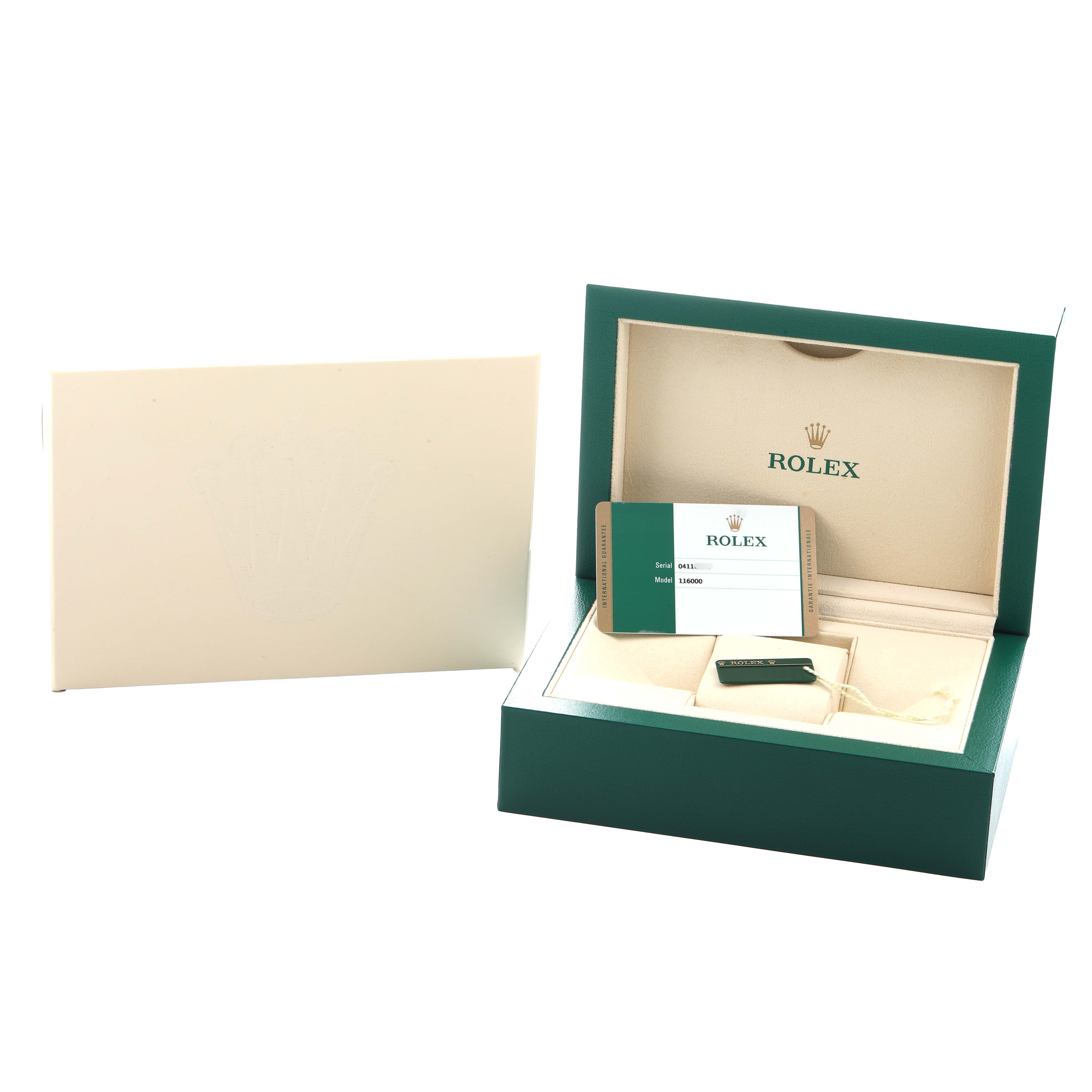 The image shows the packaging and accessories for a Rolex Oyster Perpetual 116000 Men
s Stainless Steel Champagne Dial, including the box, documentation, and tags.