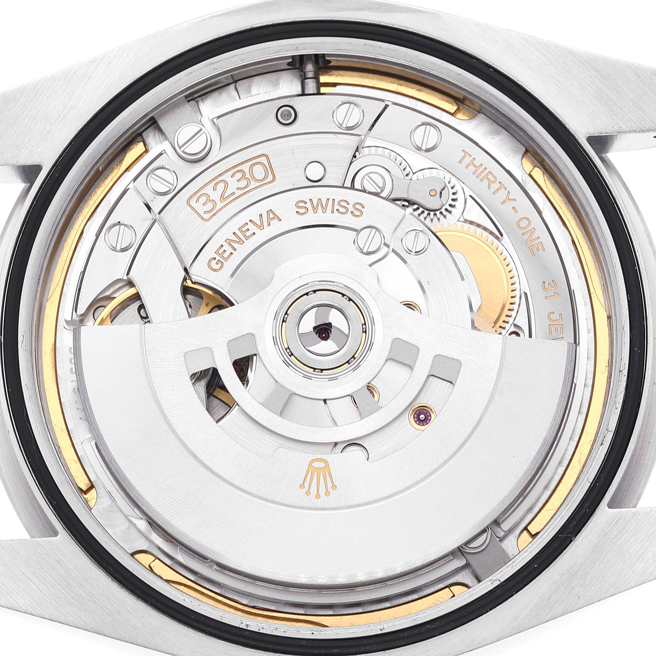 This image shows a close-up of the movement mechanism of a Rolex Oyster Perpetual 124300 Men's Stainless Steel Blue Dial 124300 Men's Stainless Steel Blue Dial watch, specifically the caliber 3230.