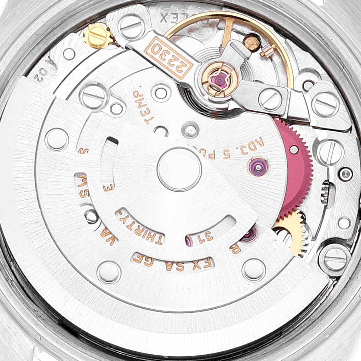The image shows a close-up of the movement mechanism for a Rolex Oyster Perpetual 76030 Women's Stainless Steel Blue Dial 76030 Women's Stainless Steel Blue Dial watch, showcasing the intricate gears and components.