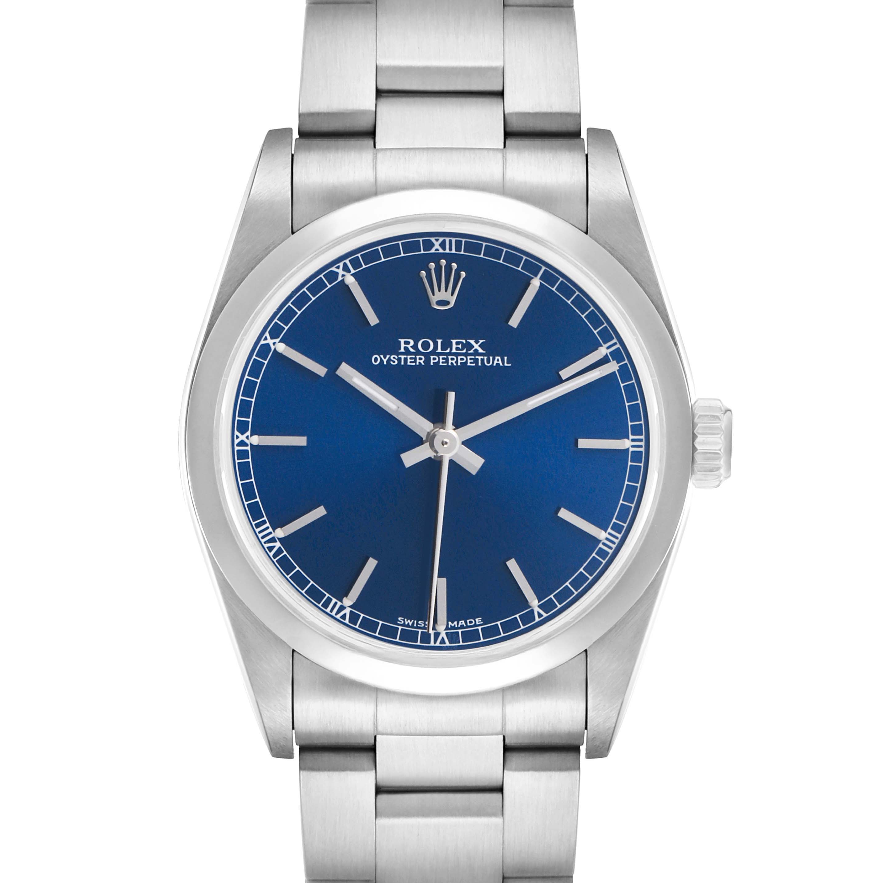 The Rolex Oyster Perpetual Mid-Size watch is shown from a front view, displaying the blue dial, hands, indices, and bracelet.