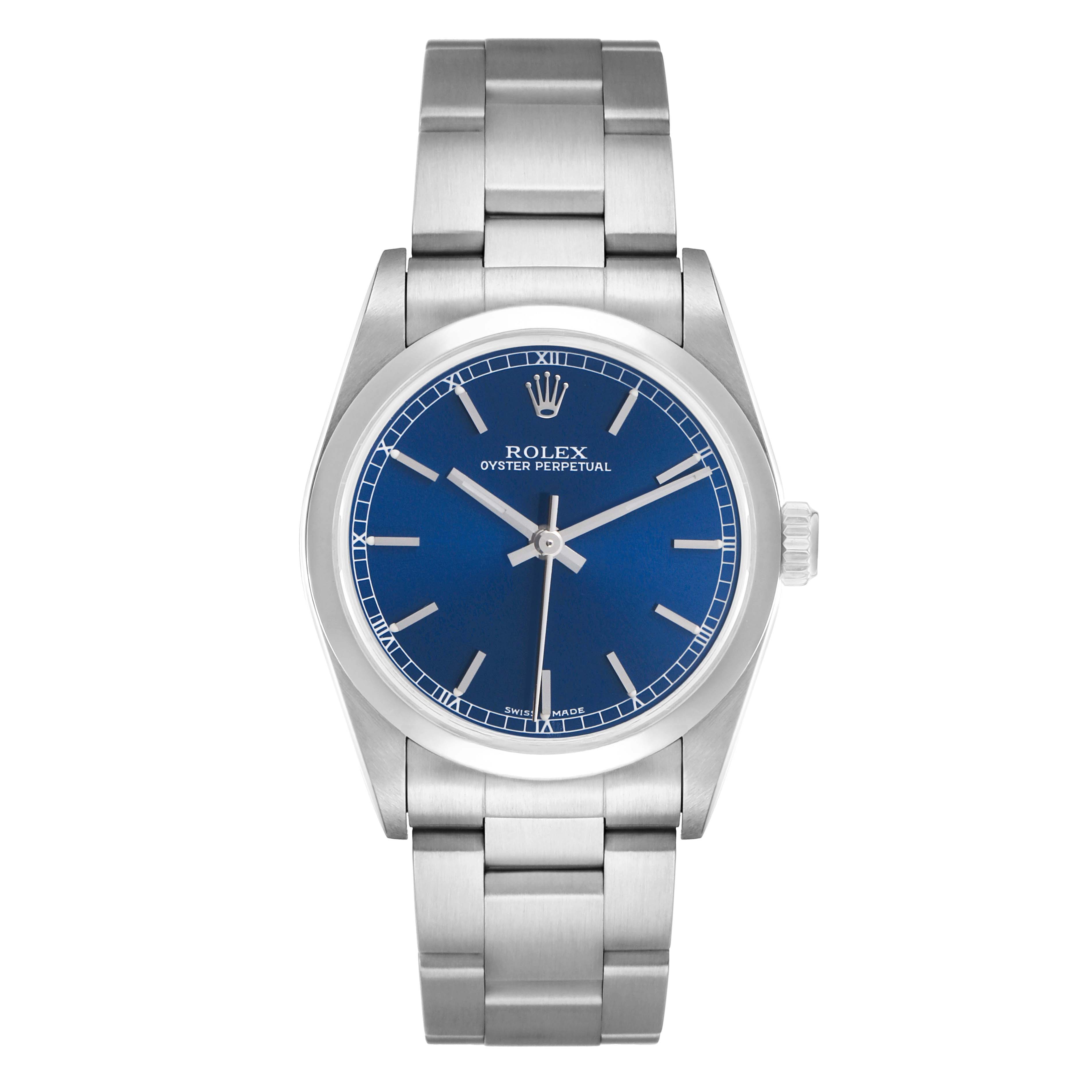 The image shows a front view of a Rolex Oyster Perpetual Mid-Size watch, featuring a blue dial and stainless steel bracelet.