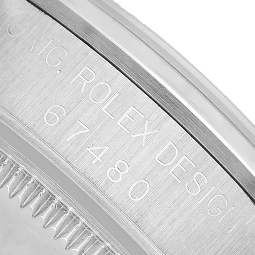 The image shows a close-up of the engraved side of a Rolex Oyster Perpetual 67480 Women's Stainless Steel Pink Dial watch case, displaying the model number.