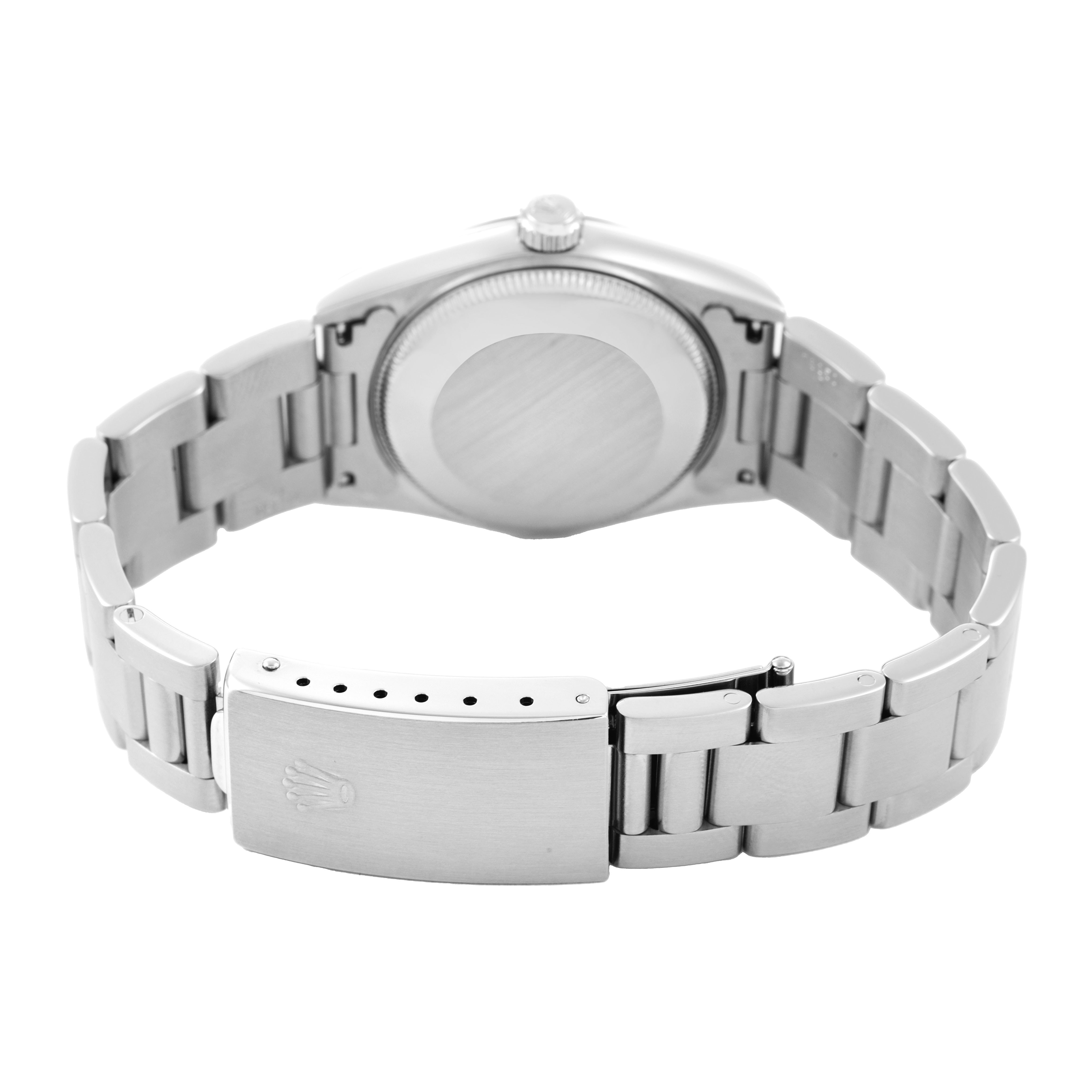The image shows the back of a Rolex Oyster Perpetual 67480 Women's Stainless Steel Pink Dial watch, highlighting the bracelet, clasp, and case back.