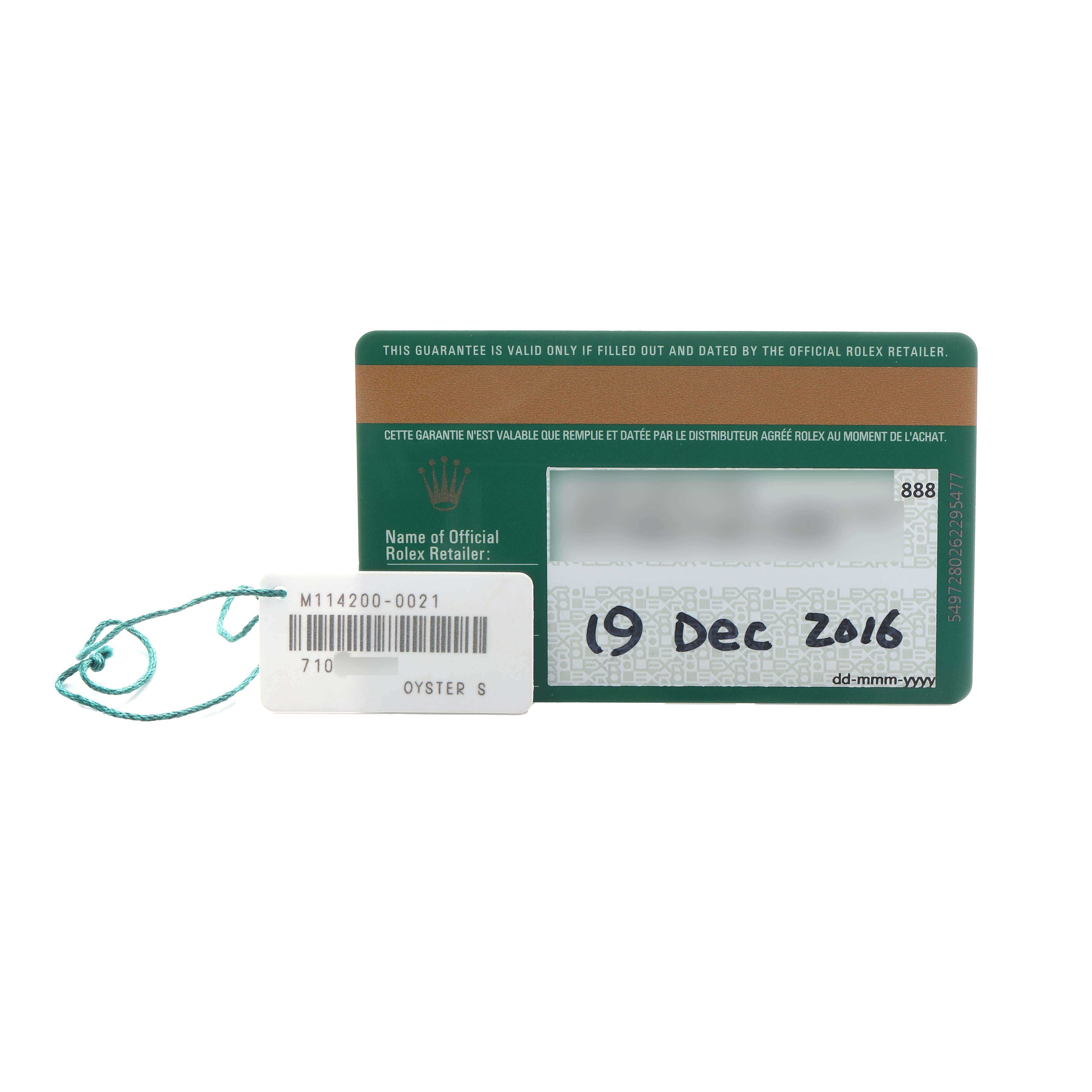 The image shows a warranty card and tag for a Rolex Oyster Perpetual 114200 Men's Stainless Steel Green Dial watch, viewed from the front.
