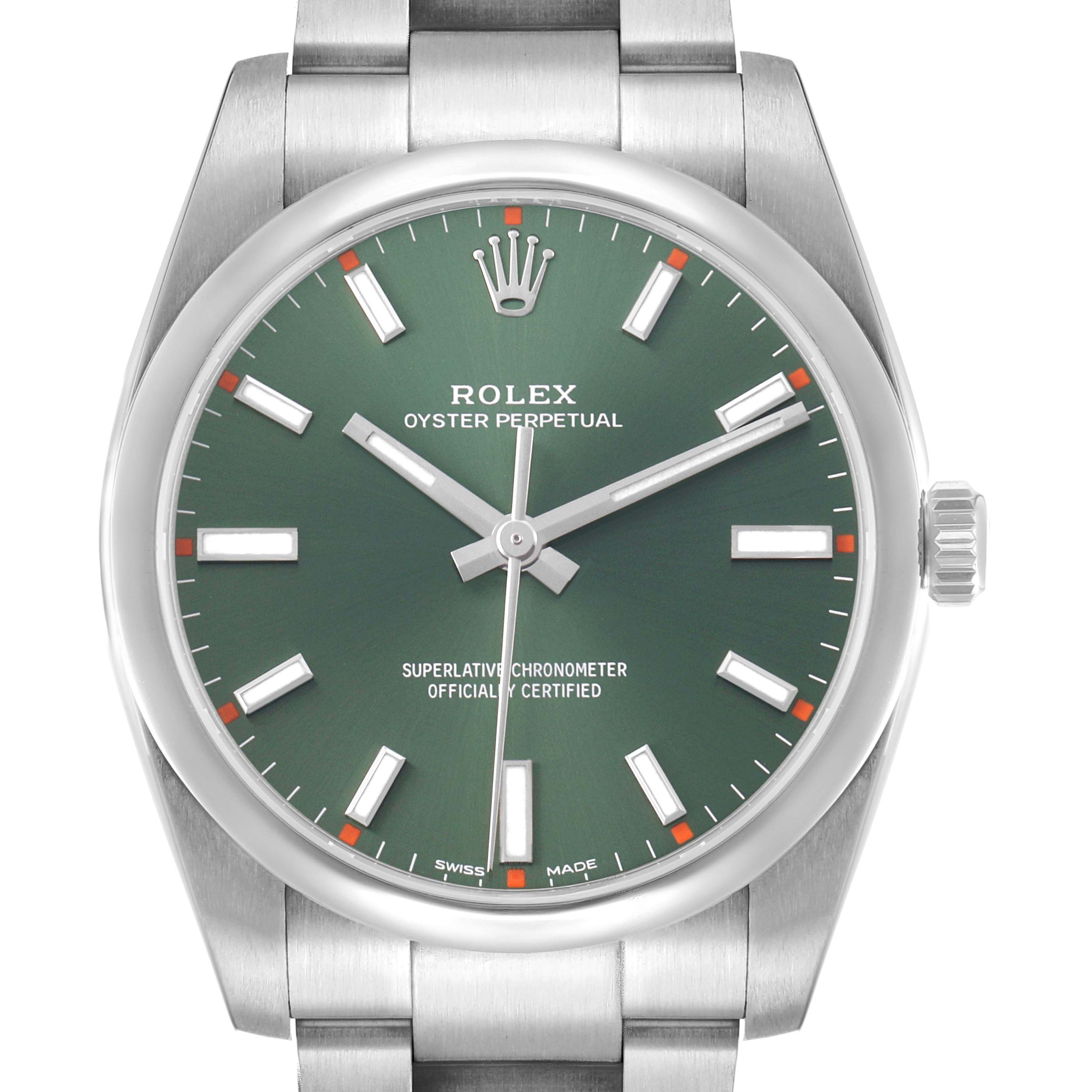 The image shows a front view of the Rolex Oyster Perpetual 114200 Men's Stainless Steel Green Dial watch, highlighting the green dial, hour markers, and crown with part of the bracelet.