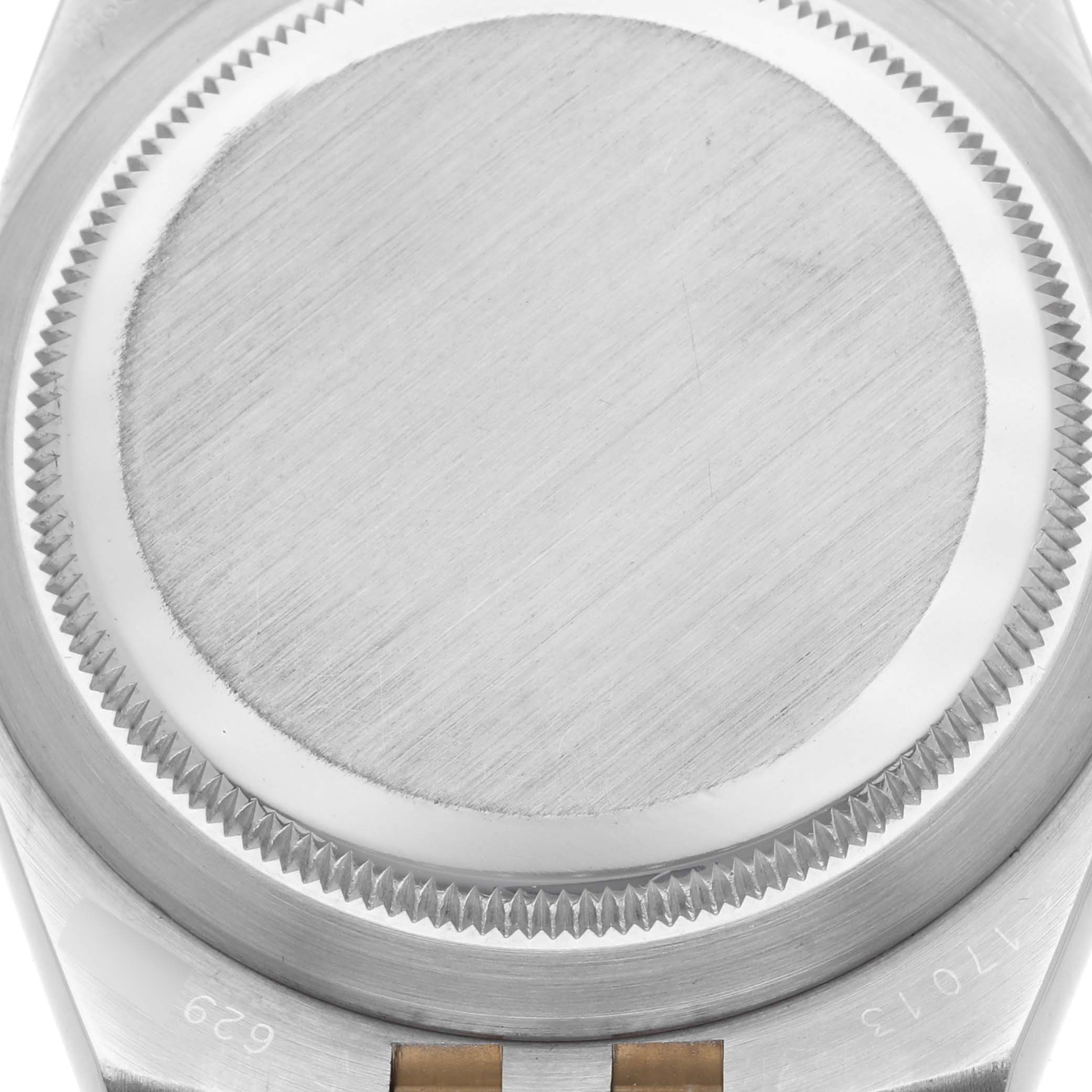 The image shows the case back of a Rolex Oysterquartz 65218 Men
s Steel and Gold (two tone) White Dial 65218 Men
s Steel and Gold (two tone) White Dial watch from a top-down angle.