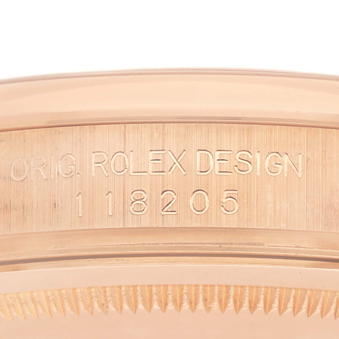 The image shows the side of the Rolex President 118205 Men's Rose Gold Silver Dial 118205 Men's Rose Gold Silver Dial model with engraved design and model number.