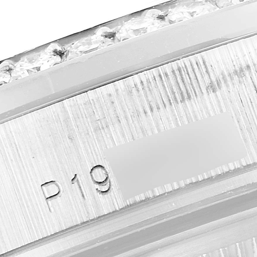 This image shows a close-up view of the bezel and serial number on a Rolex President 118346 Men's Platinum Silver Dial 118346 Men's Platinum Silver Dial model watch.