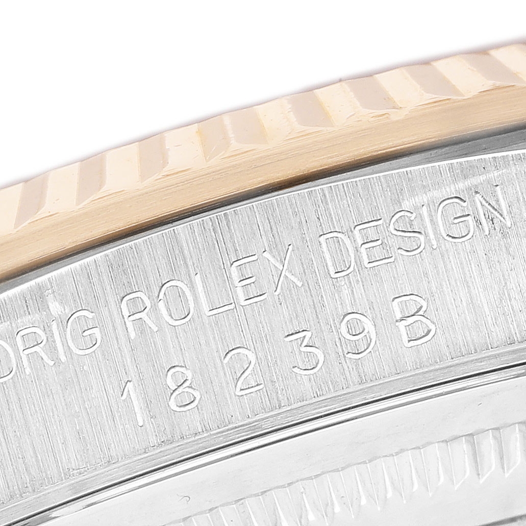 The image shows a close-up of the fluted bezel and engraved side of a Rolex President 18239B Men's White Gold Champagne Dial watch.