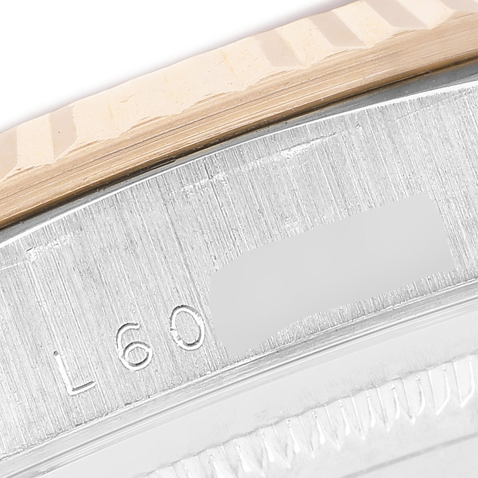 The image shows a close-up of the fluted bezel edge of a Rolex President 18239B Men's White Gold Champagne Dial model.