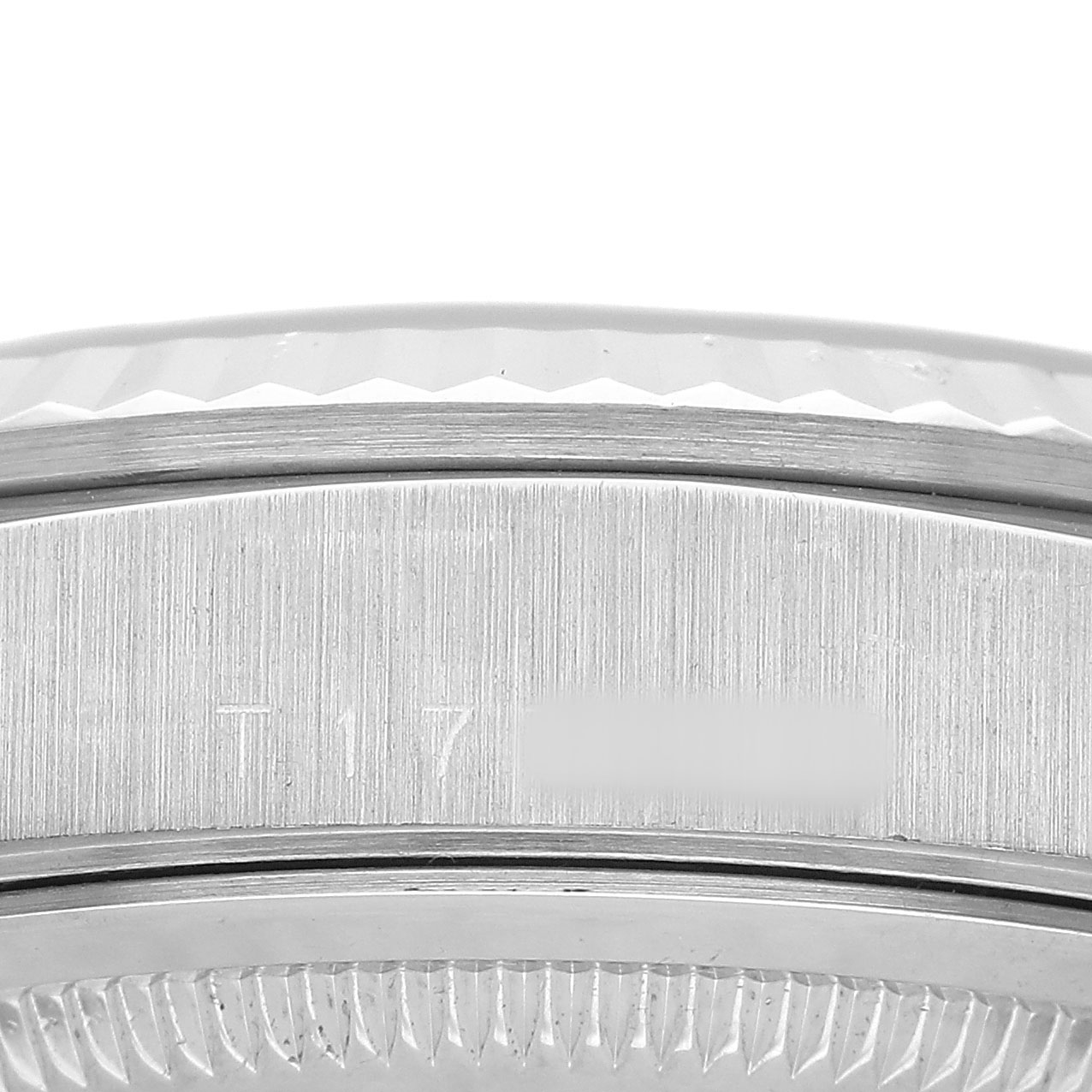 The image shows a close-up of the side of a Rolex President 18239 Men's White Gold Silver Dial watch, highlighting the case and bezel area.