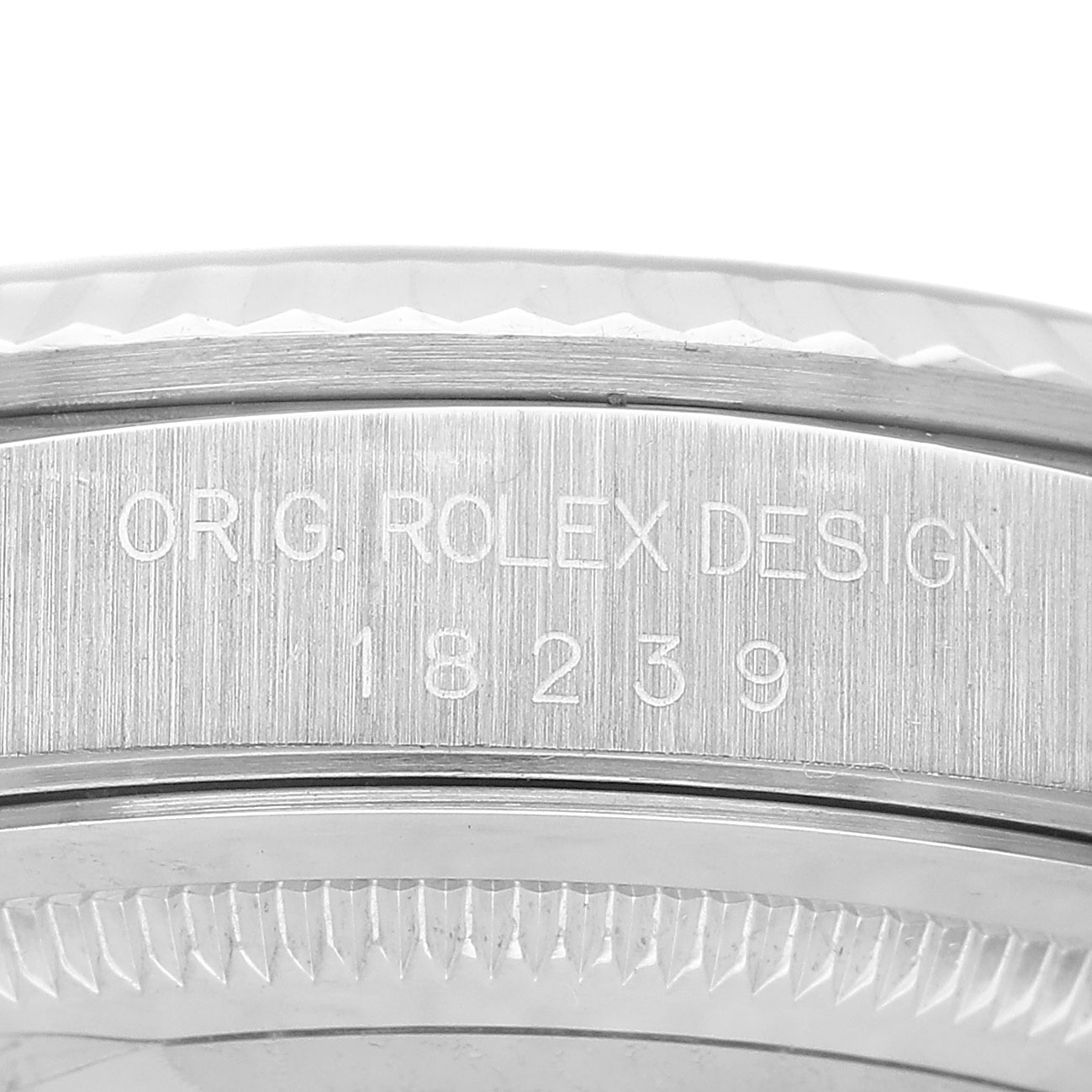The image shows a close-up of the engraved side with the model number of the Rolex President 18239 Men's White Gold Silver Dial watch.