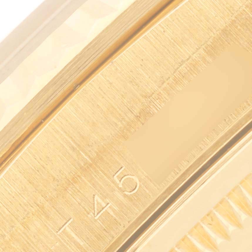 The image shows a close-up of the bezel and edge of the Rolex President 18238 Men's Yellow Gold White Dial 18238 Men's Yellow Gold White Dial watch, highlighting its engraved details.