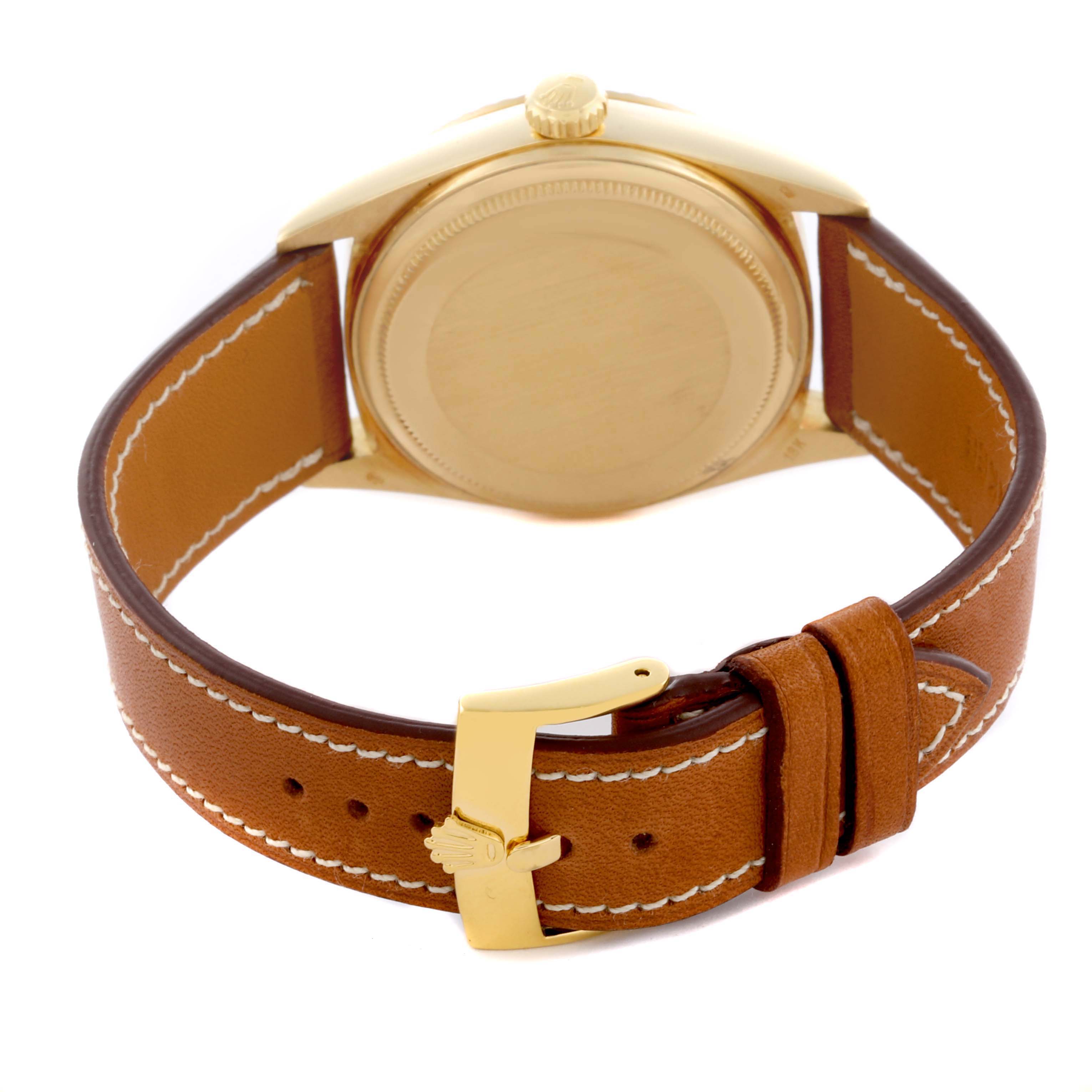 The Rolex President 18038 Men
s Yellow Gold Champagne Dial 18038 Men
s Yellow Gold Champagne Dial watch is shown from the back, highlighting the case and brown leather strap with a gold buckle.