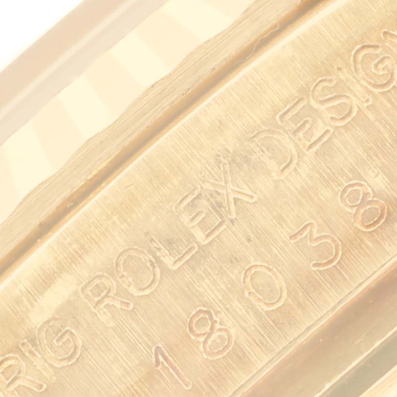The image shows a close-up of the engraved side of a Rolex President 18038 Men
s Yellow Gold Champagne Dial 18038 Men
s Yellow Gold Champagne Dial watch.