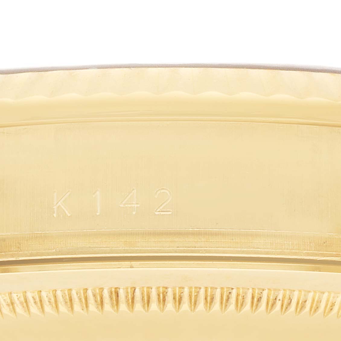 The image shows a close-up side view of the Rolex President 118238 Men
s Yellow Gold Champagne Dial model, focusing on part of the case with visible engravings.