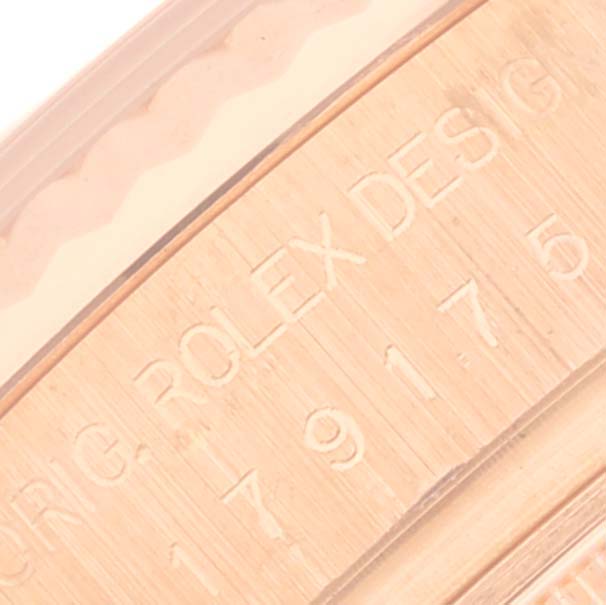 The image shows a close-up of the engraving on the side of a Rolex Datejust watch case.