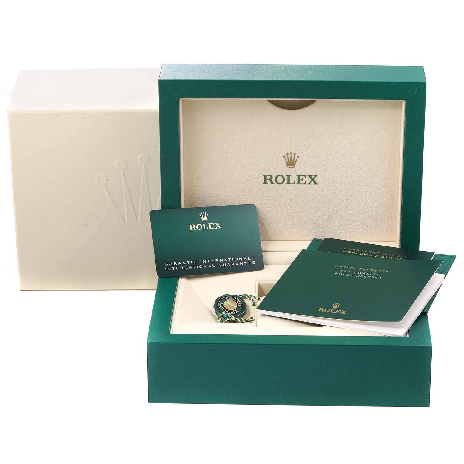 The image shows the box and accessories, including documents and tags, for a Rolex Sea-Dweller 126660 Men
s Stainless Steel Blue Dial 126660 Men
s Stainless Steel Blue Dial watch.