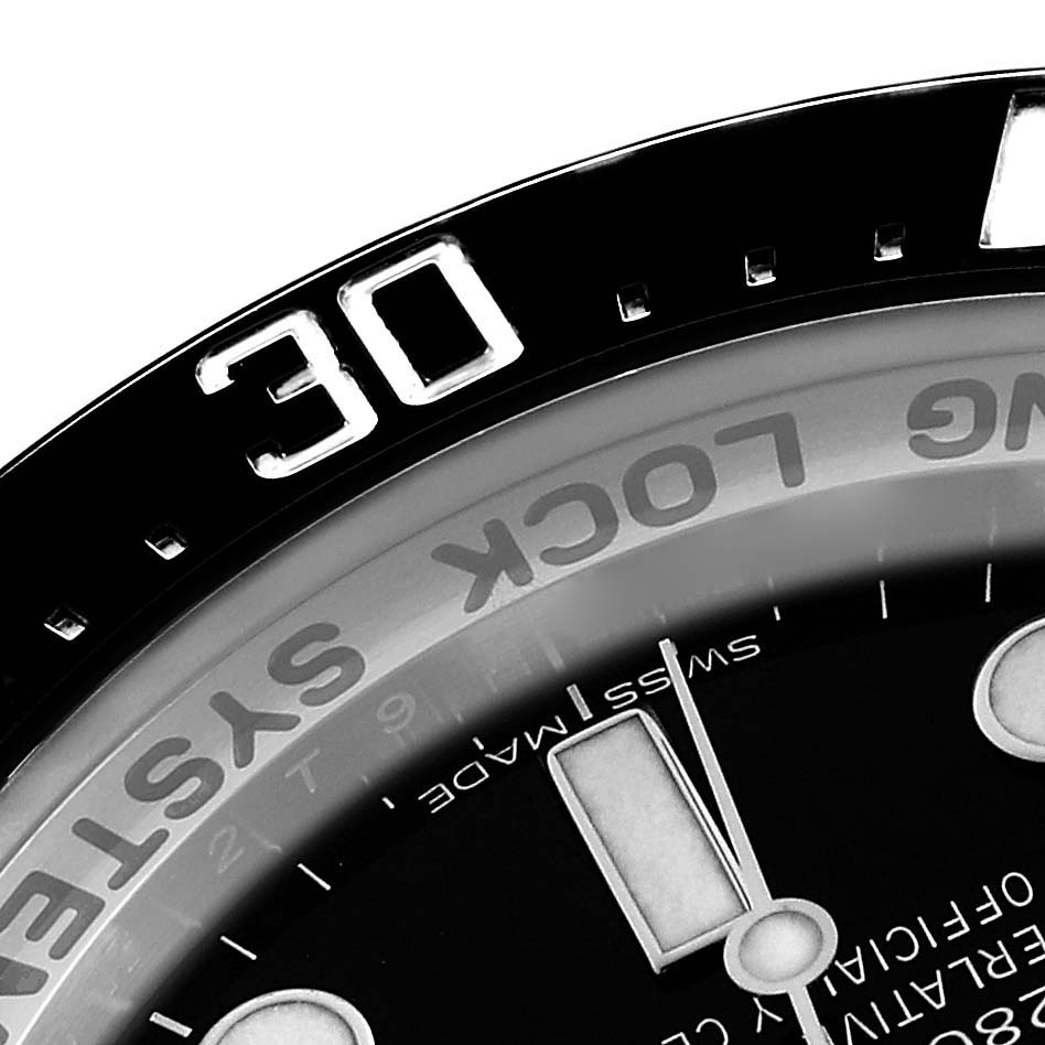 The image shows a close-up of the bezel and partial dial of a Rolex Sea-Dweller 116660 Men's Stainless Steel Blue Dial, highlighting the 30-minute mark.