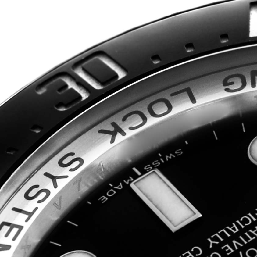 The image shows a close-up of the bezel and dial of a Rolex Sea-Dweller 116660 Men
s Stainless Steel Black Dial, highlighting the "30" marker and "RING LOCK SYSTEM" text.