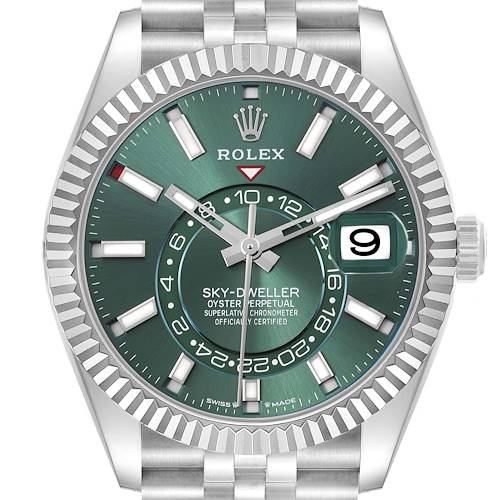 The Rolex Sky-Dweller watch face is shown from the front, highlighting its green dial, markers, and date window.