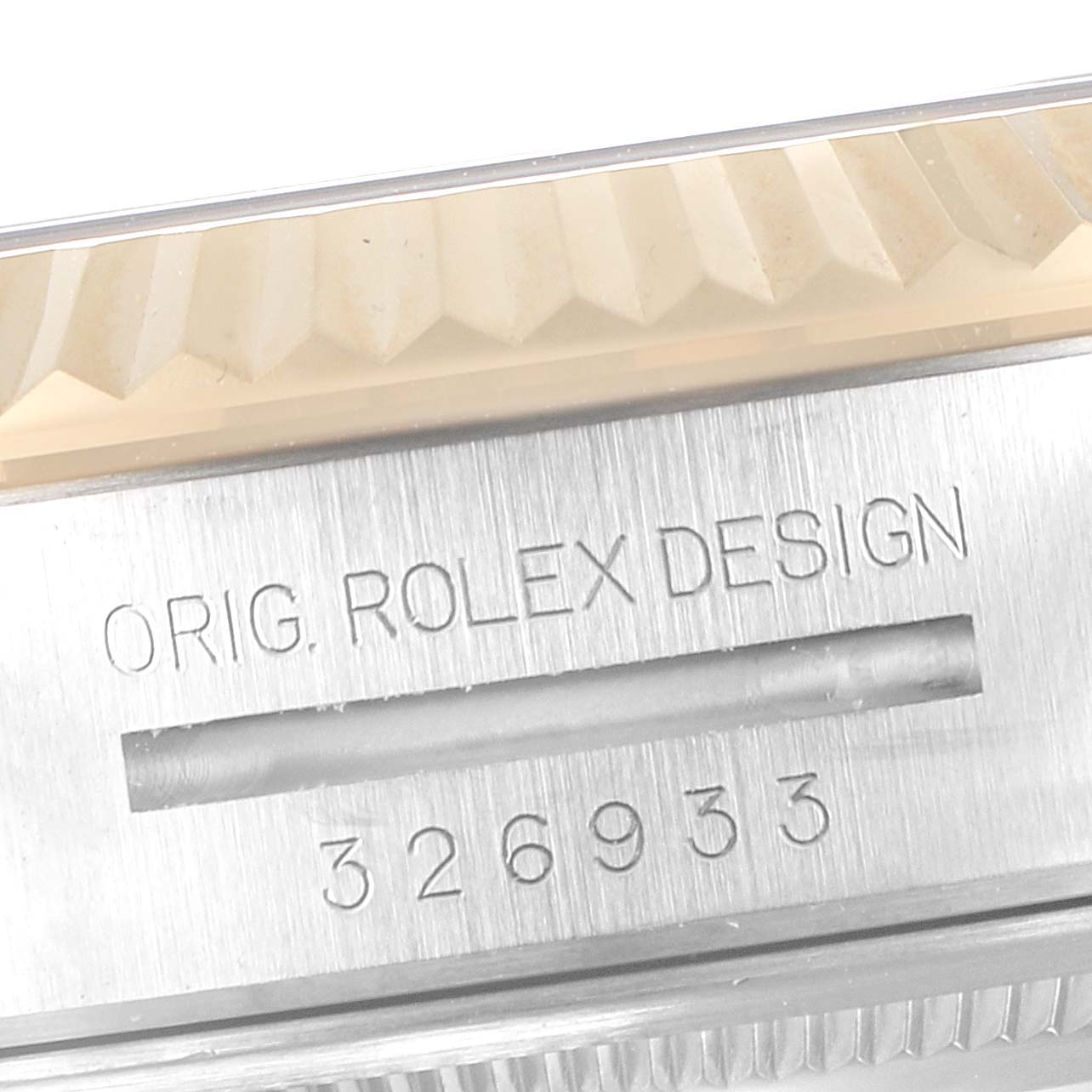 The image shows a close-up of the serial number and "ORIG. ROLEX DESIGN" engraving on the side of a Rolex Sky-Dweller 326933 Men's Steel and Gold (two tone) Black Dial 326933 Men's Steel and Gold (two tone) Black Dial model.