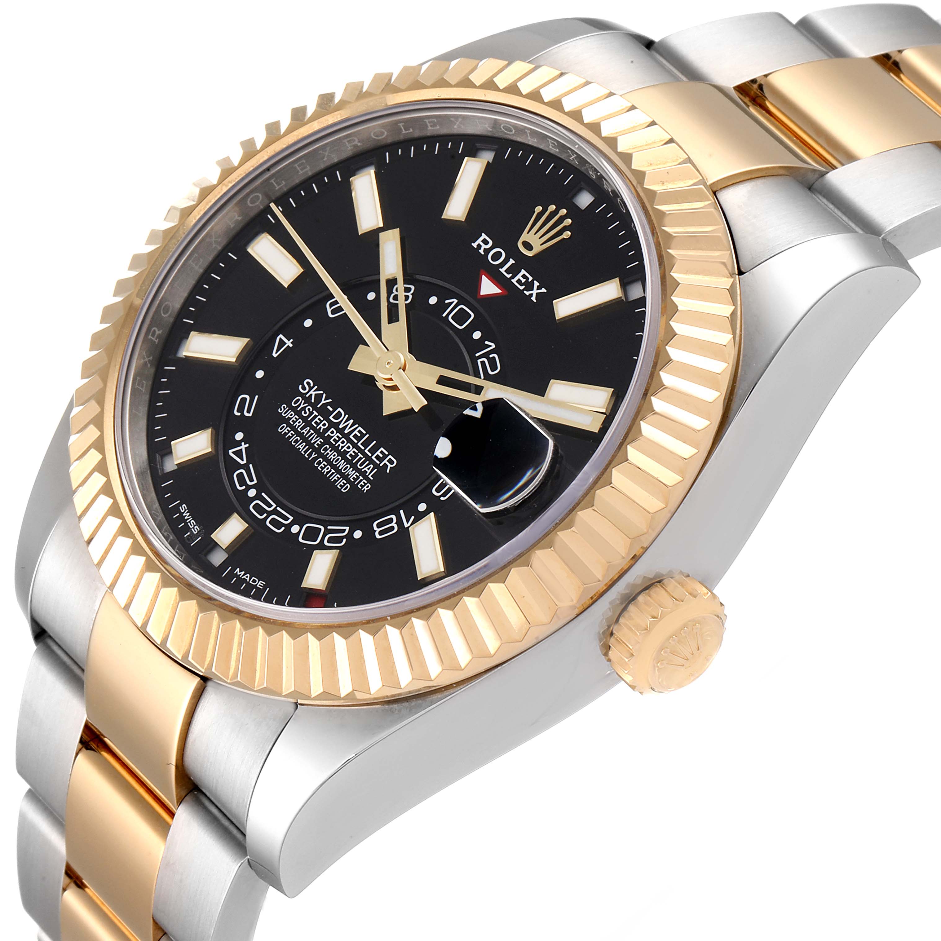 The Rolex Sky-Dweller 326933 Men's Steel and Gold (two tone) Black Dial 326933 Men's Steel and Gold (two tone) Black Dial watch is shown at an angled close-up, highlighting its bezel, crown, bracelet, and dial.