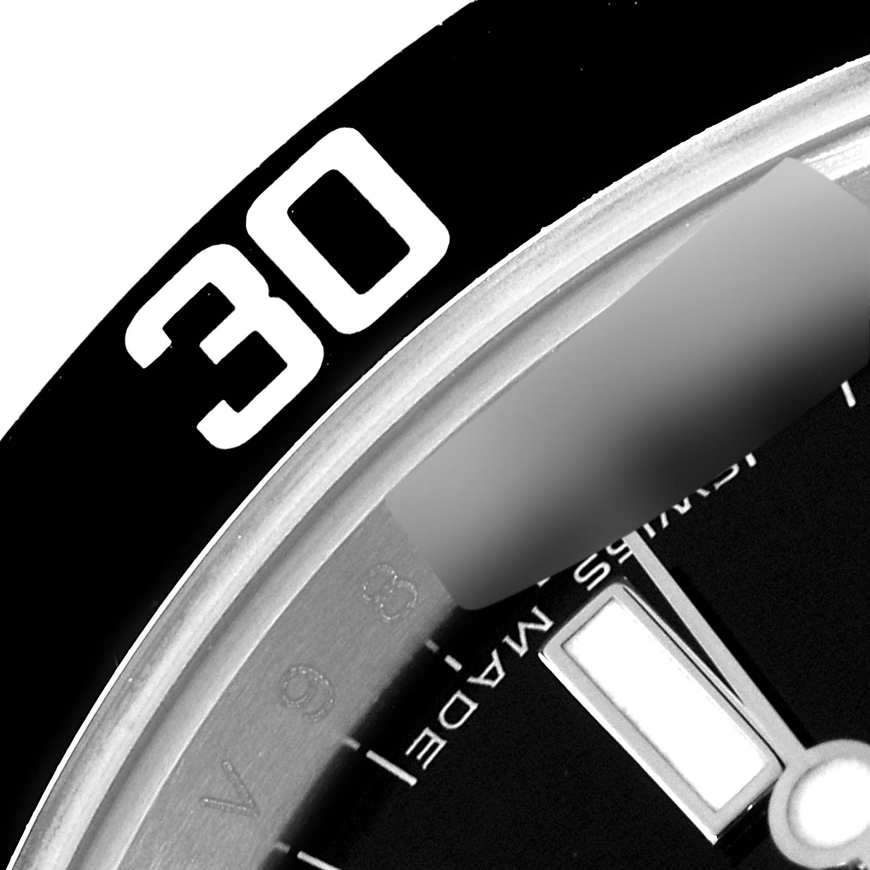 The image shows an angled close-up of the bezel and part of the dial of the Rolex Submariner 14060M Men
s Stainless Steel Black Dial 14060M Men
s Stainless Steel Black Dial watch.