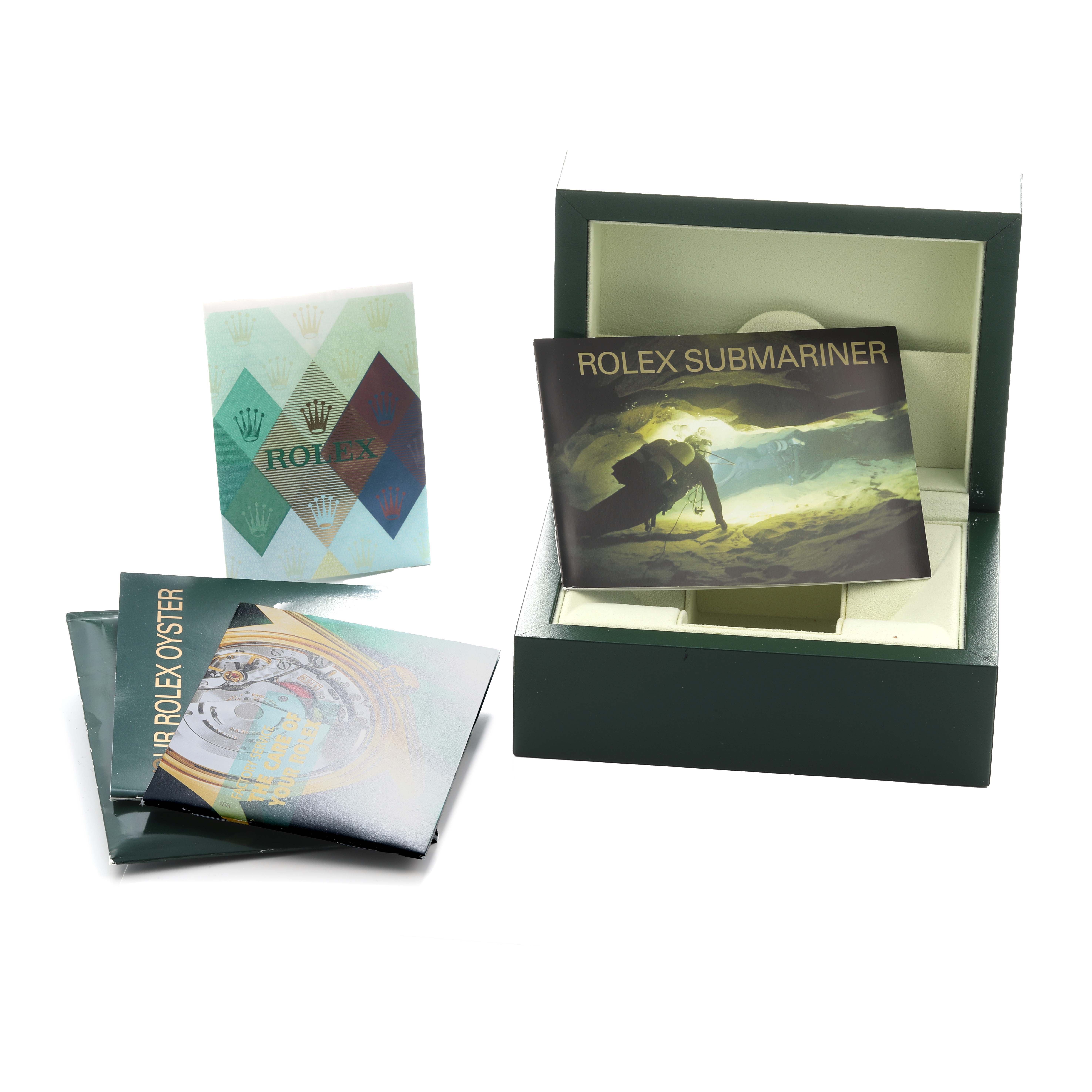 The image shows the packaging and booklets for a Rolex Submariner 16610 Men
s Stainless Steel Black Dial, including the box and manuals.