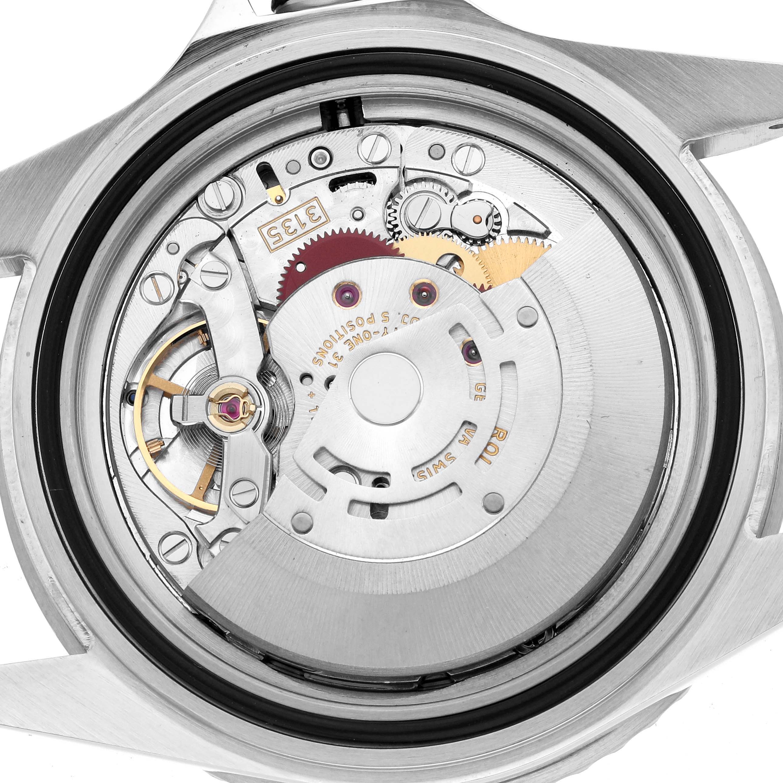 This image shows the back view of a Rolex Submariner 16610 Men
s Stainless Steel Black Dial, highlighting its intricate inner mechanical components.