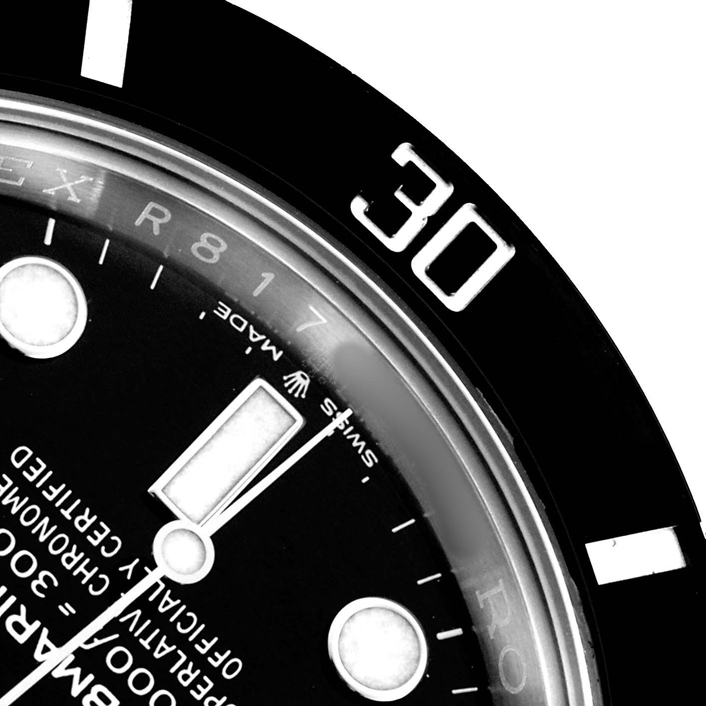 The image shows a close-up view of the dial and bezel of a Rolex Submariner 126610 Men
s Stainless Steel Black Dial watch, focusing on the minute markers and text.