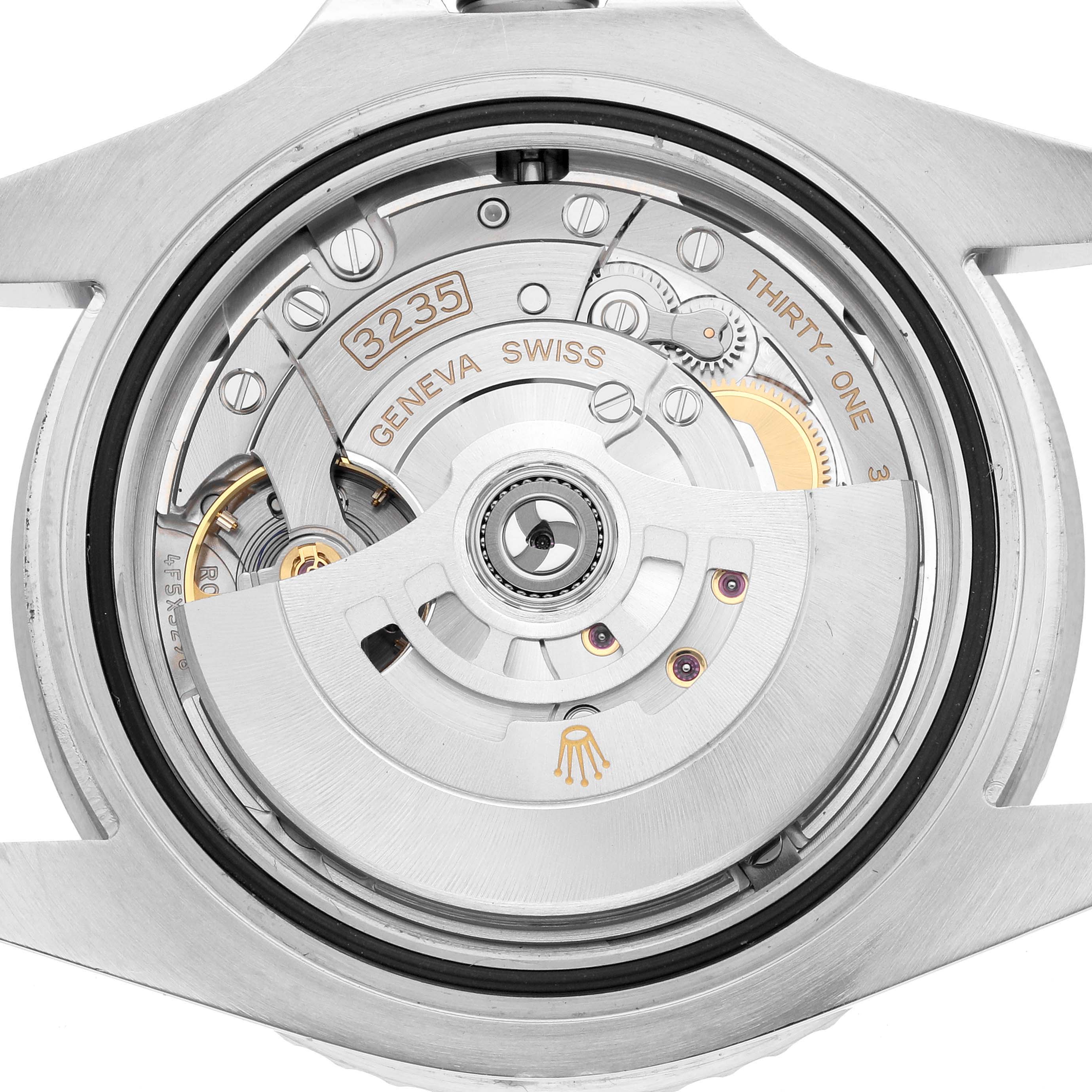 This image shows the movement of a Rolex Submariner 126610 Men
s Stainless Steel Black Dial watch from the back, highlighting the 3235 caliber mechanism.