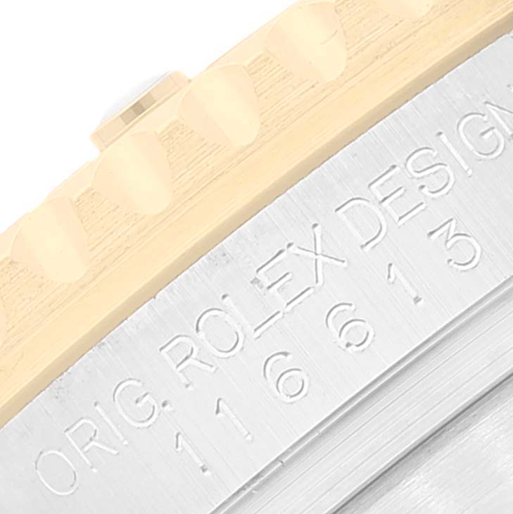 The image shows a close-up of the bezel and case side of a Rolex Submariner 116613 Men's Steel and Gold (two tone) Blue Dial 116613 Men's Steel and Gold (two tone) Blue Dial, highlighting the model number and "ORIG. ROLEX DESIGN" engraving.