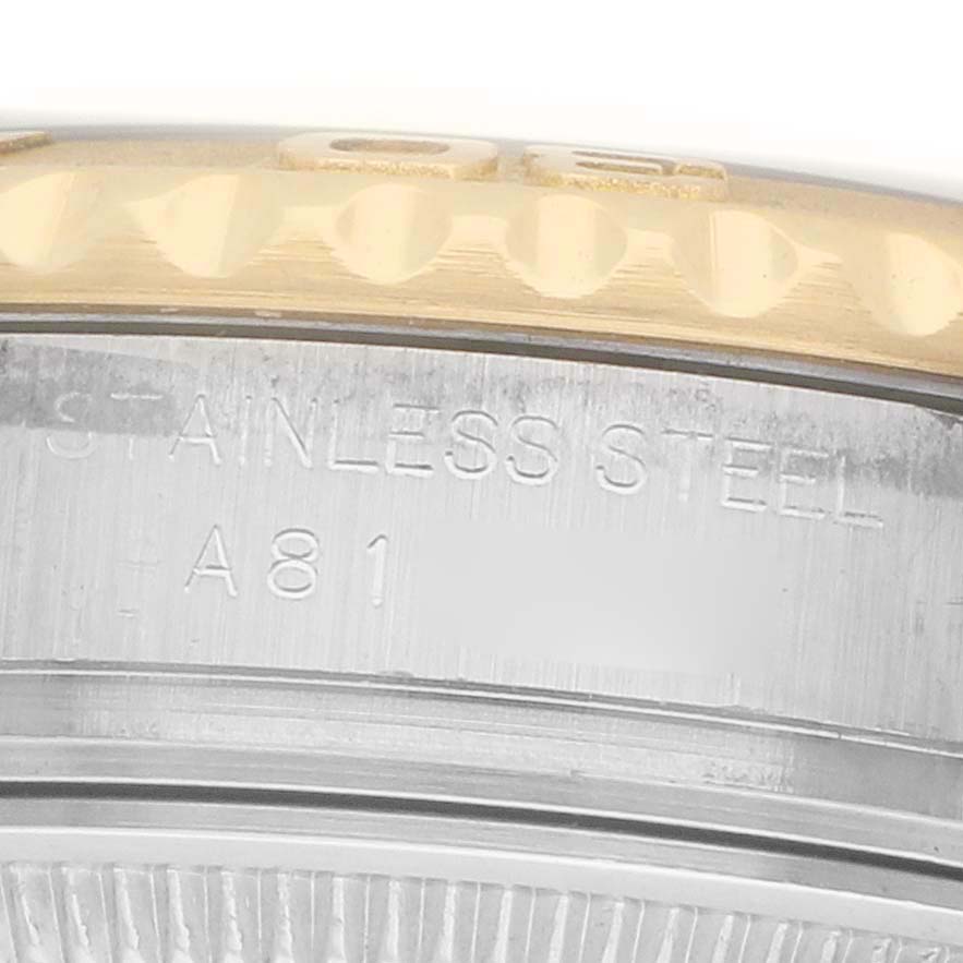 The image shows a side view of the bezel and case of a Rolex Yacht-Master 169623 Women's Steel and Gold (two tone) Silver Dial, highlighting the stainless steel and engraved text.