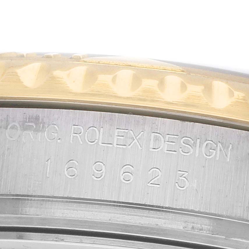 The image shows a close-up side view of the Rolex Yacht-Master 169623 Women's Steel and Gold (two tone) Silver Dial case, highlighting the bezel and model engraving.