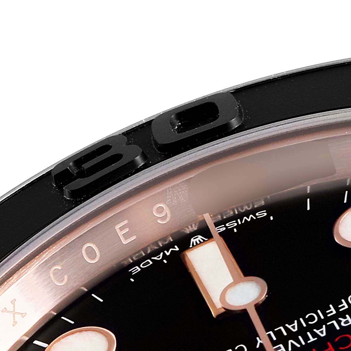 The image shows a close-up of the bezel and part of the dial of a Rolex Yacht-Master 126655 Men's Rose Gold Black Dial 126655 Men's Rose Gold Black Dial watch.