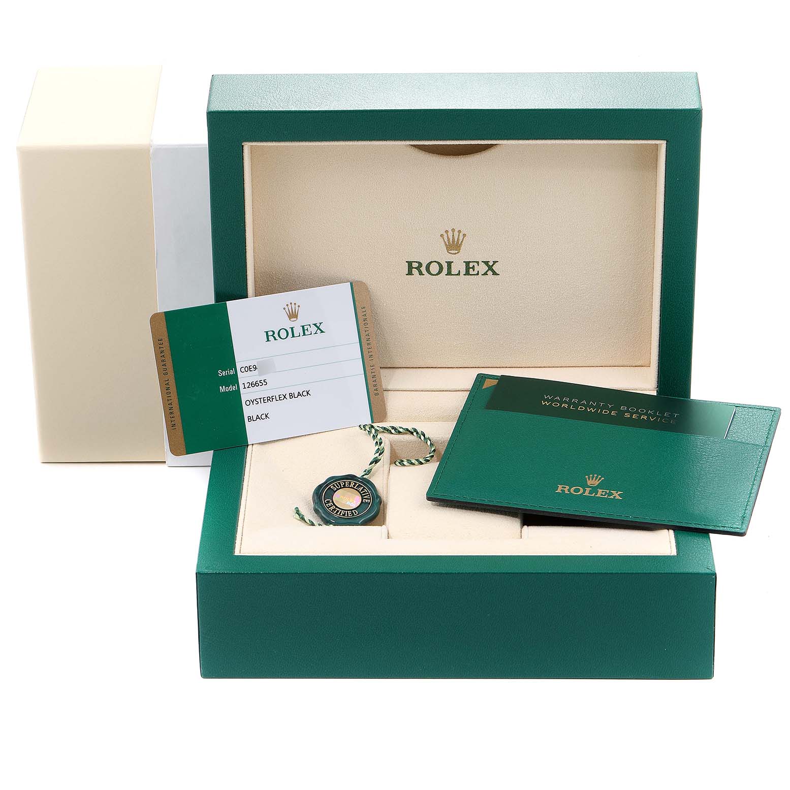 This image shows the open packaging of a Rolex Yacht-Master 126655 Men's Rose Gold Black Dial 126655 Men's Rose Gold Black Dial watch model, including a warranty booklet, tag, and card.