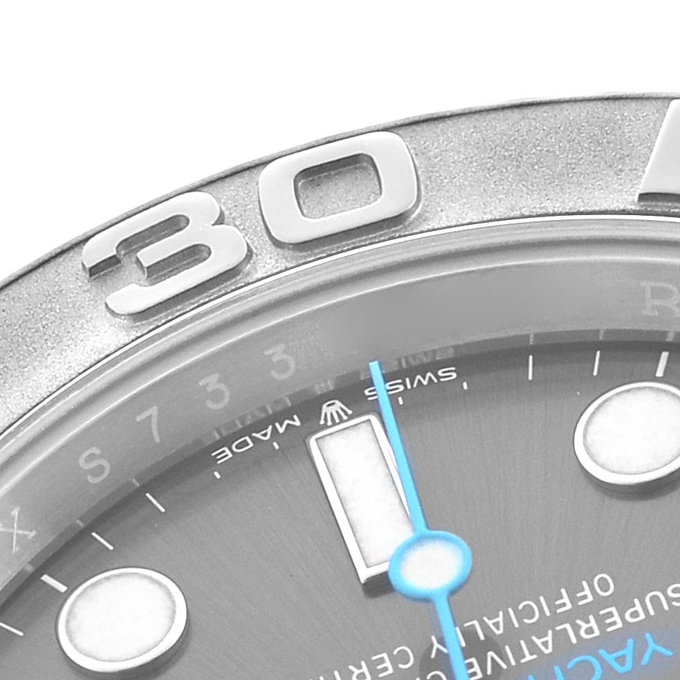 The image shows a close-up of the Rolex Yacht-Master 126622 Men
s Stainless Steel Silver Dial watch
s bezel, hour markers, and a portion of the dial.