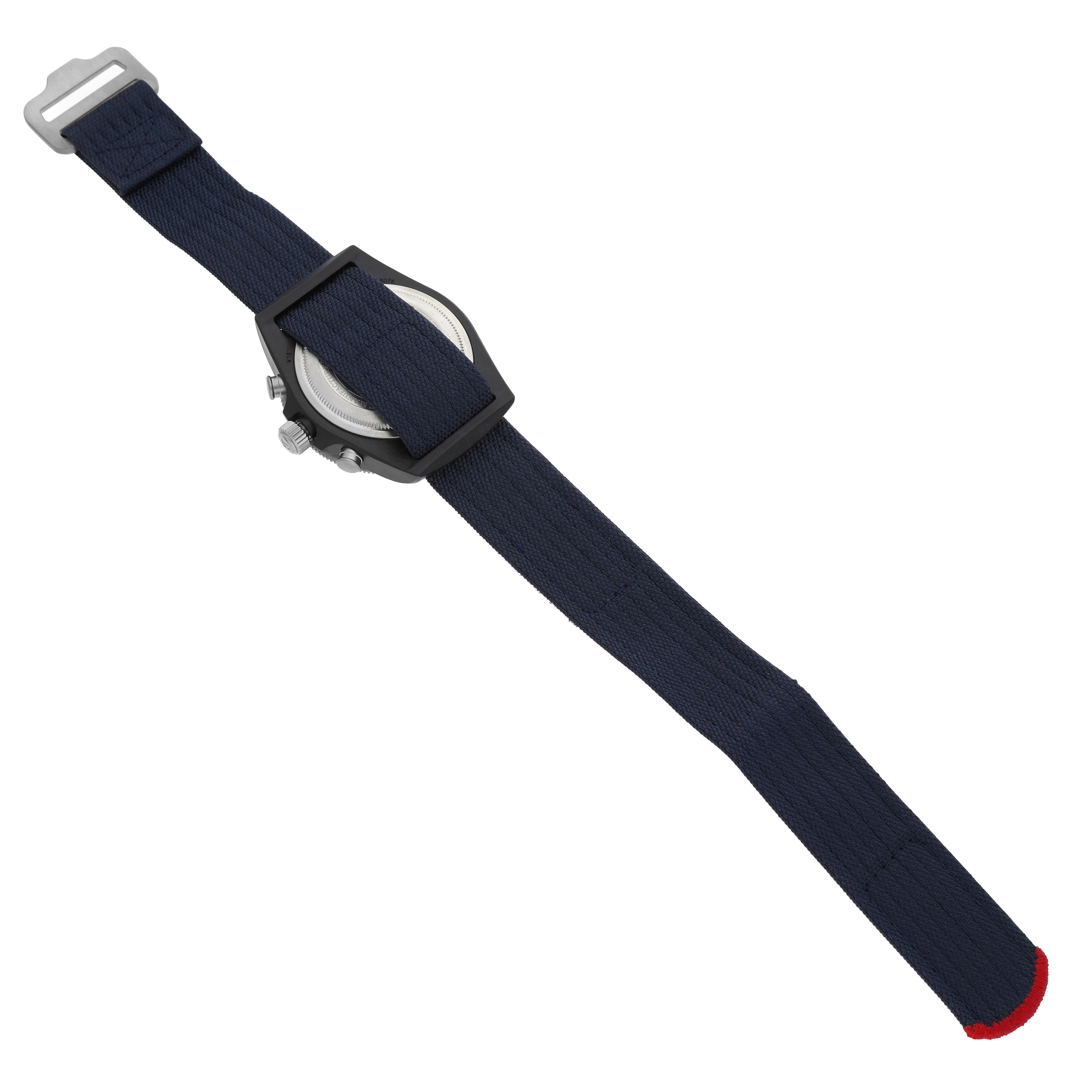 The Tudor Pelagos 25807 Men's Ceramic Blue Dial watch is shown from the back, highlighting the case back and fabric strap.