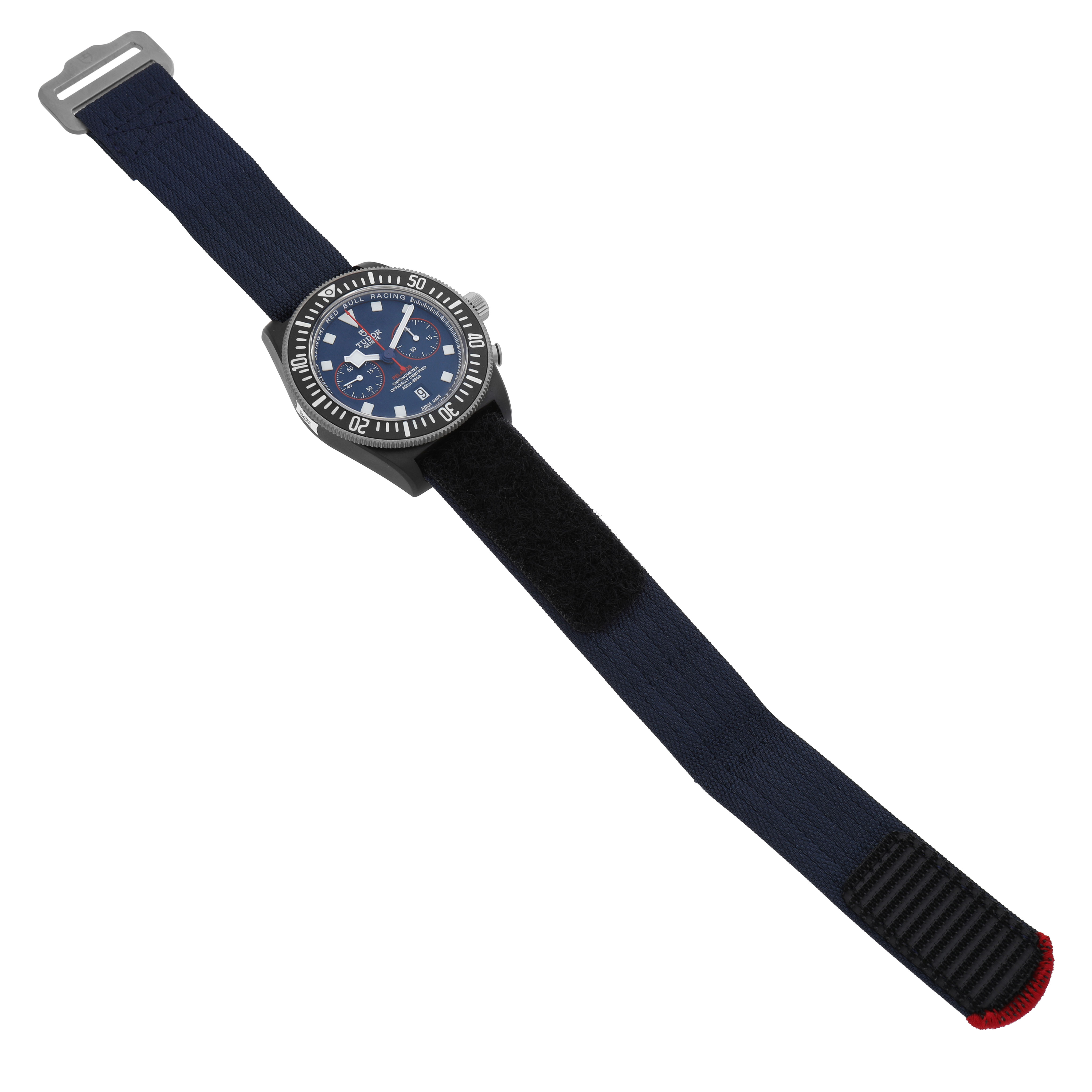 The Tudor Pelagos 25807 Men's Ceramic Blue Dial watch is shown from a top-down angle, highlighting the strap, dial, and bezel details.
