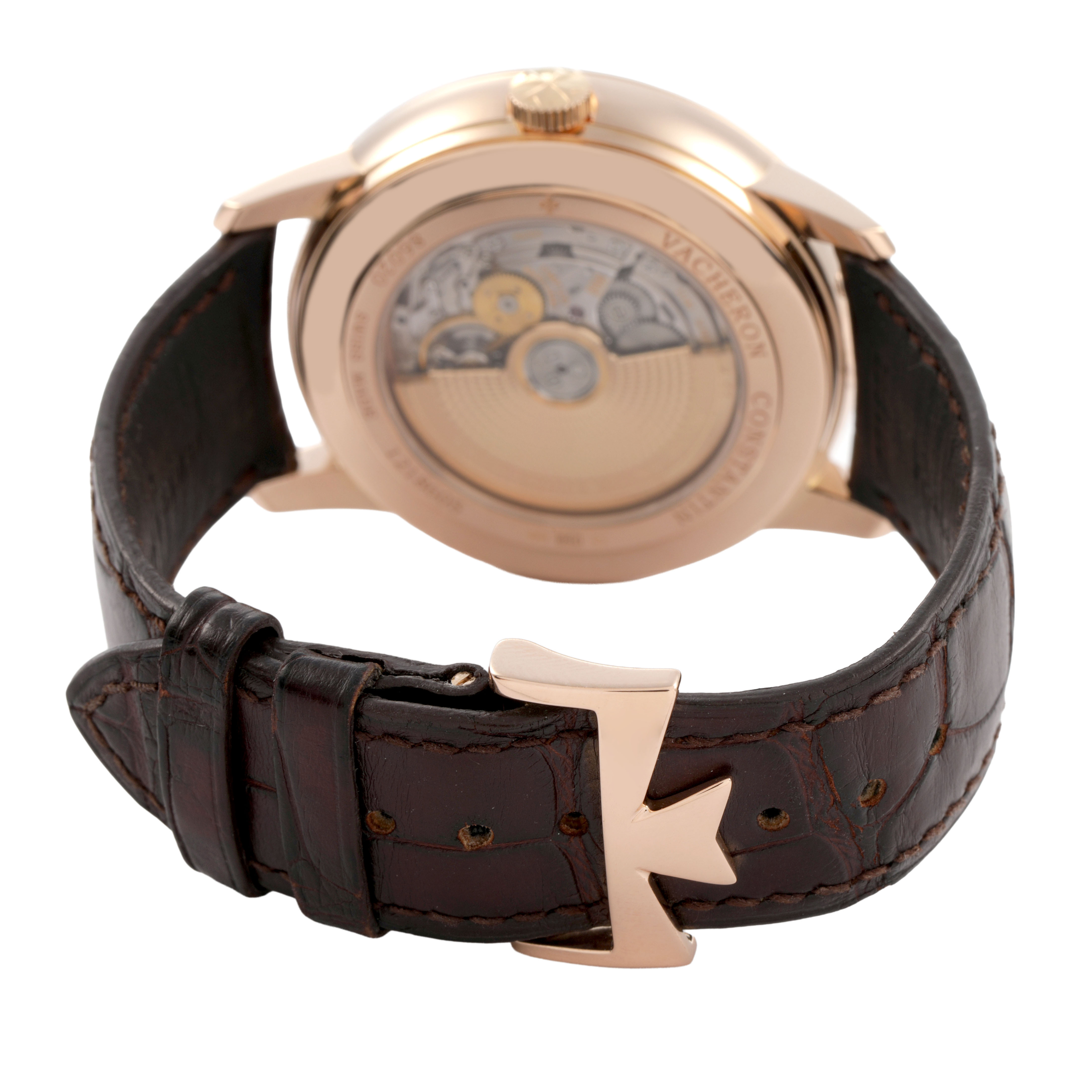 The image shows the backside of the Vacheron Constantin Patrimony 86020 Men's Rose Gold Silver Dial watch, featuring the case back, movement, and leather strap with a distinctive clasp.