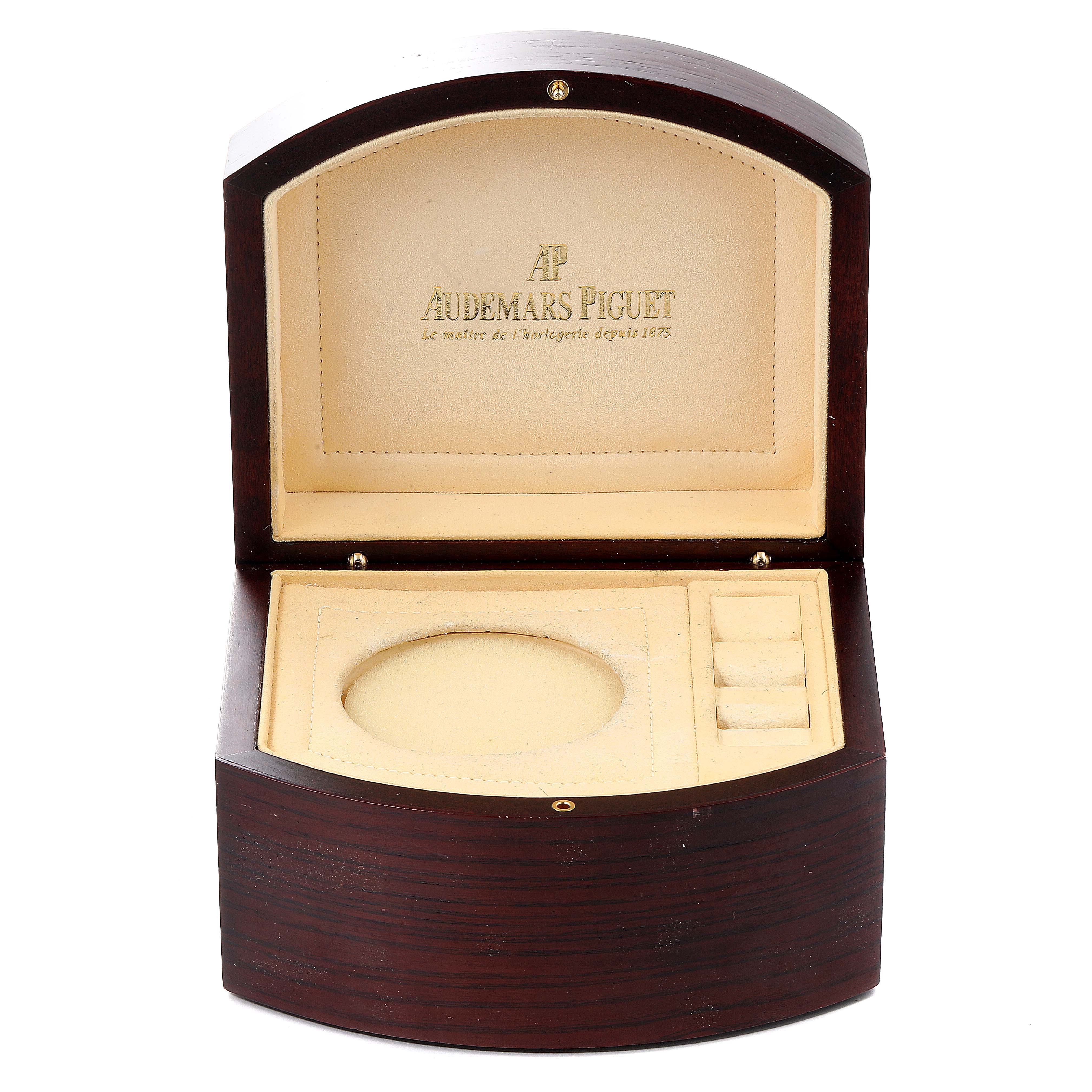 This image shows an open presentation box for an Audemars Piguet Millenary 77301ST.ZZ.D303CR.01 Women's Stainless Steel Silver Dial 77301ST.ZZ.D303CR.01 Women's Stainless Steel Silver Dial watch, featuring a slot for the watch and compartments for accessories.
