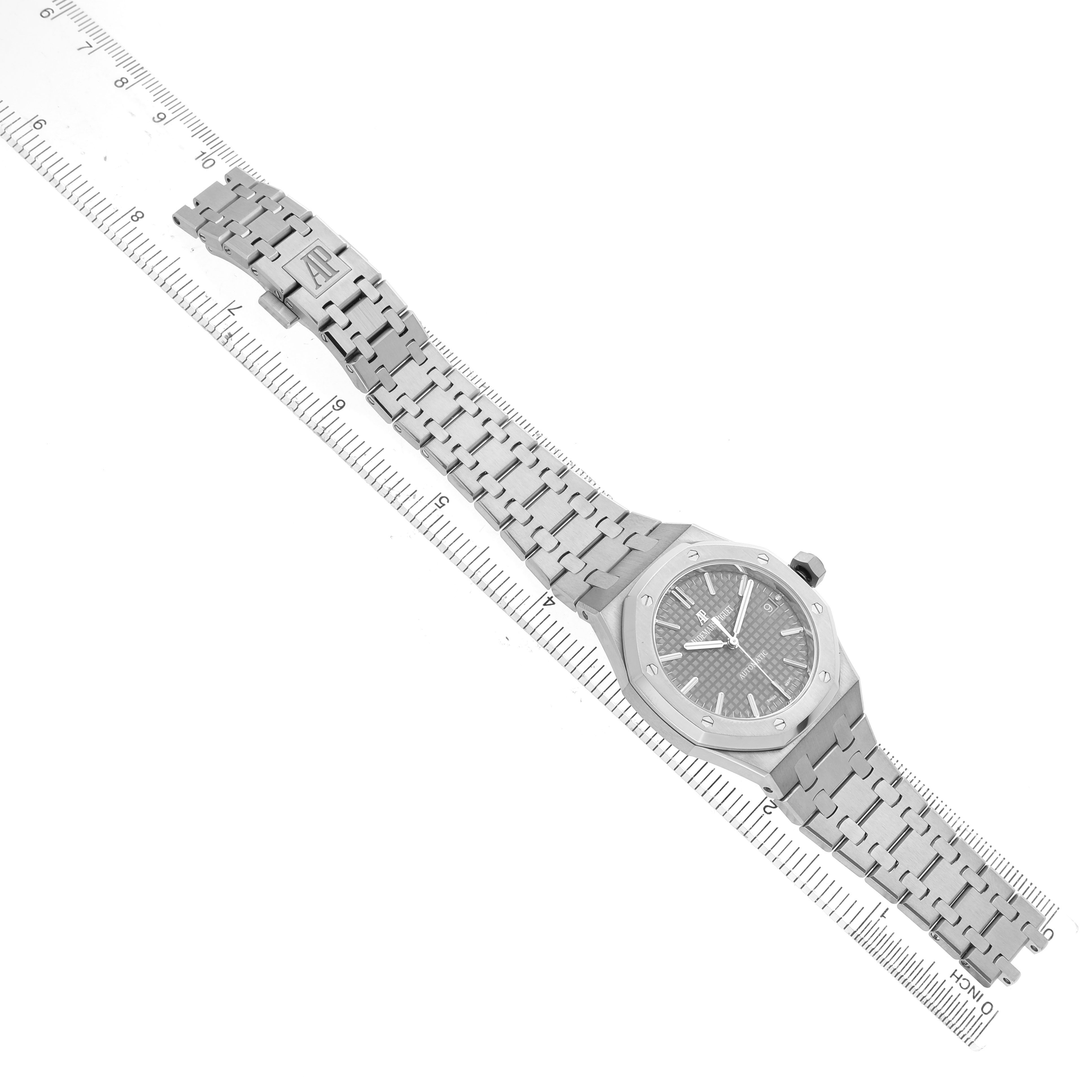 The image shows a Royal Oak model by Audemars Piguet, showcasing the watch face and bracelet from an angled overhead view.