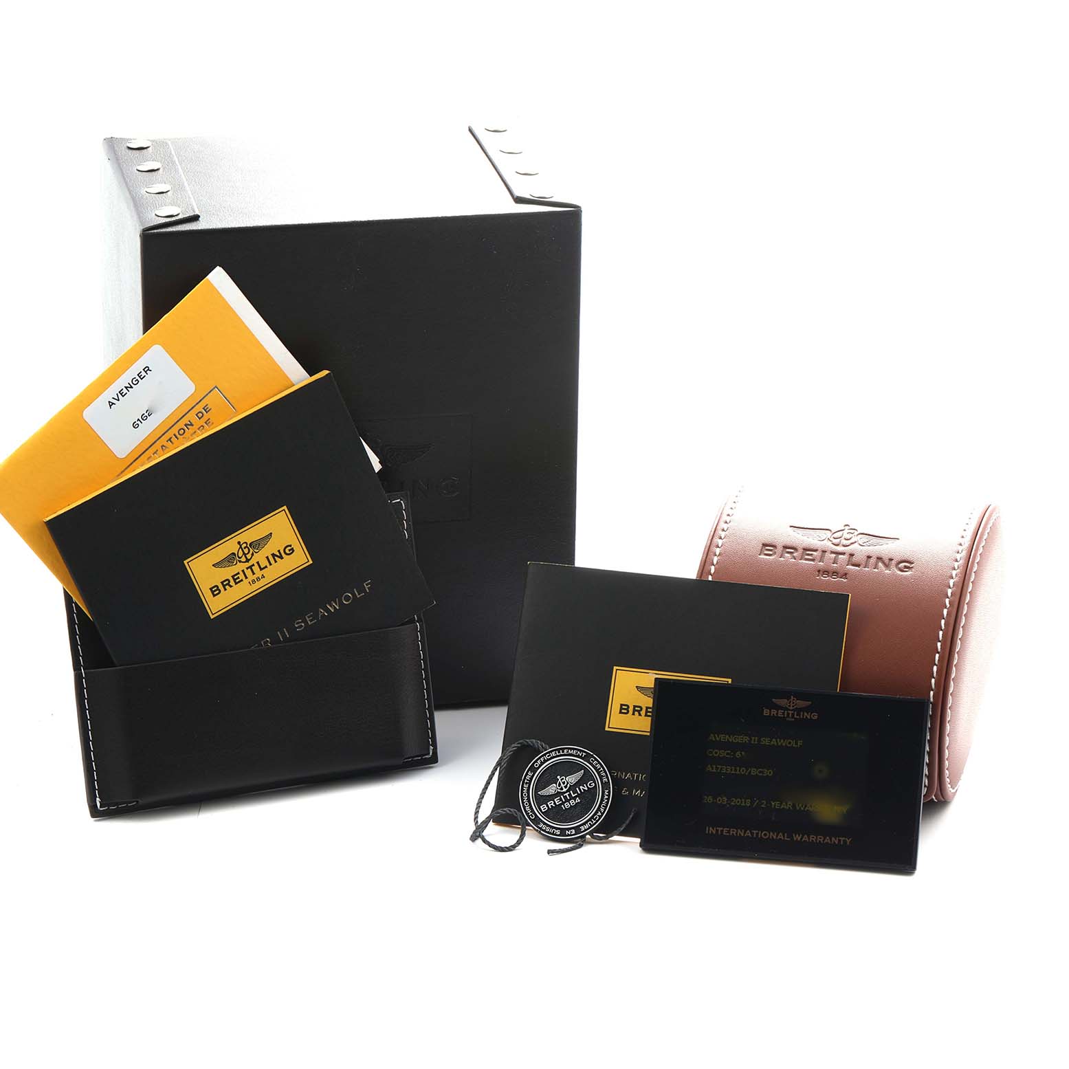 The image shows Breitling Avenger A17331 Men
s Stainless Steel Black Dial packaging, including a box, manuals, a warranty card, and a leather case, angled from the front.