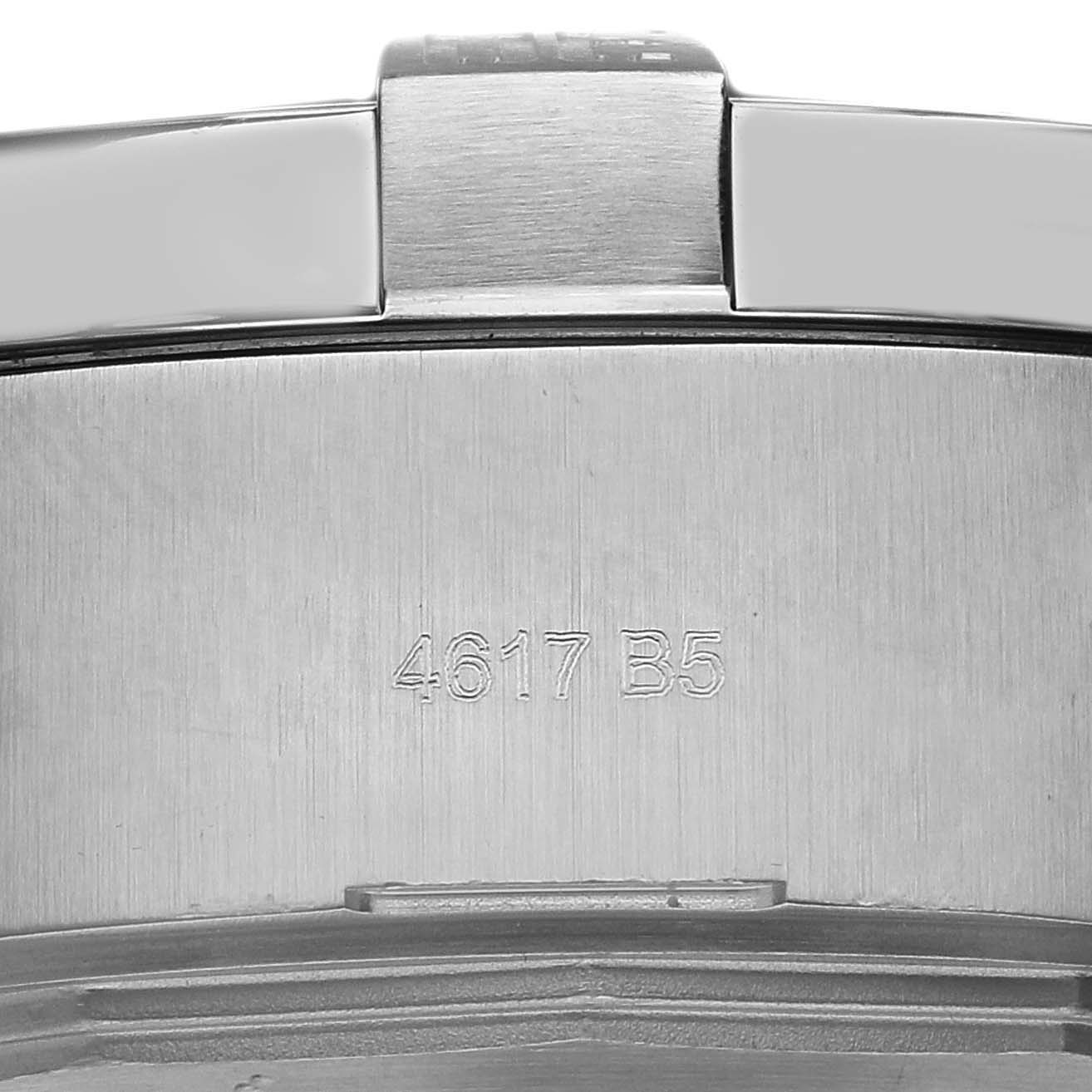 The image shows the engraved clasp of a Breitling Avenger A17331 Men
s Stainless Steel Black Dial watch bracelet from a close-up angle.