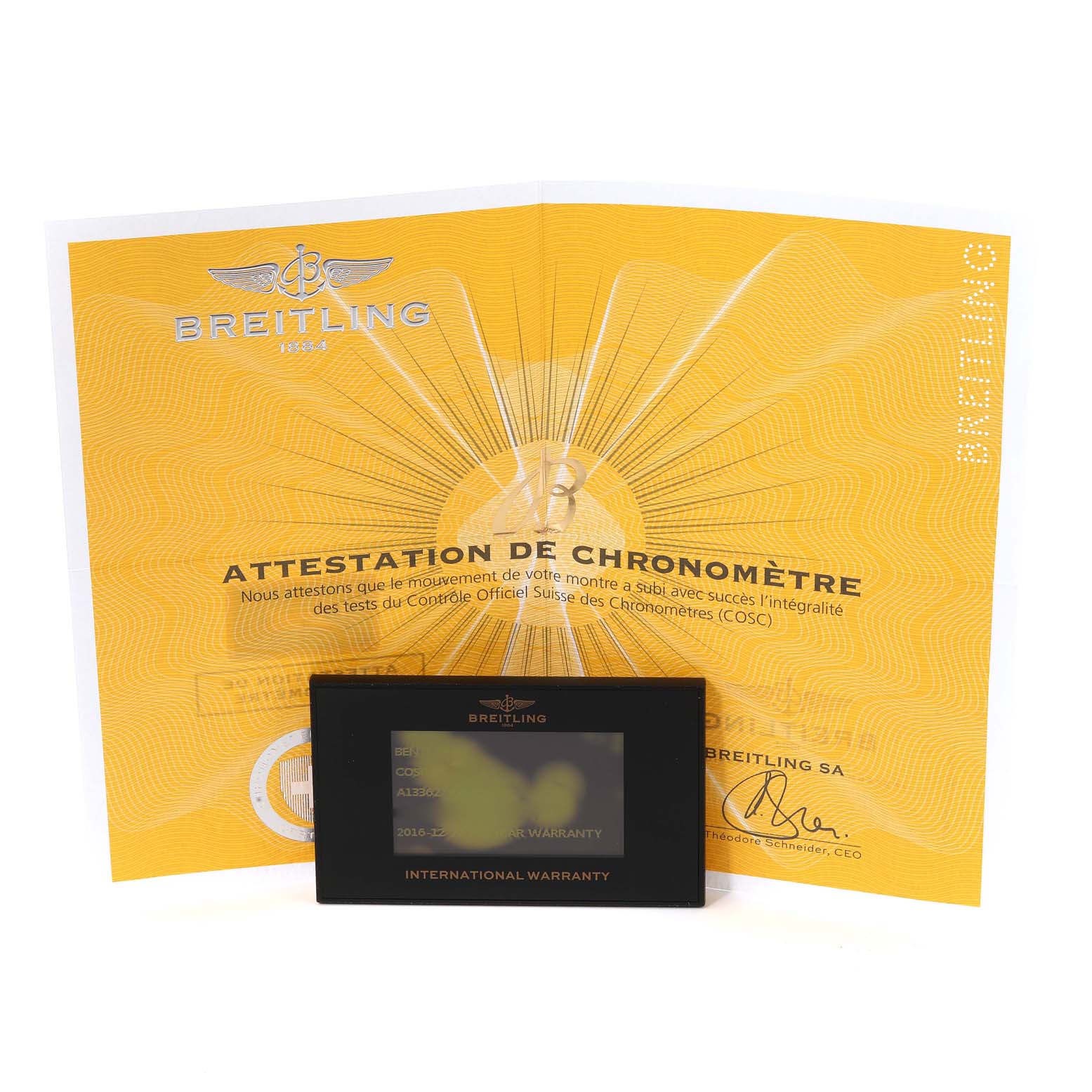 The image shows an international warranty card and chronometer certificate for the Bentley model by Breitling.